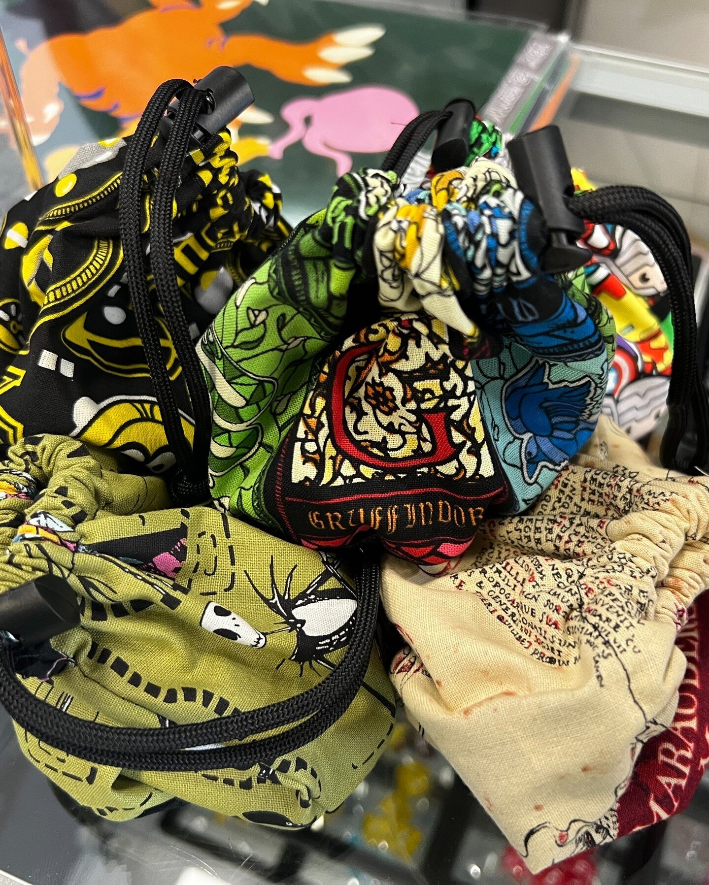 Dice and dice bags for all your needs. Many colors and styles available at The Green.