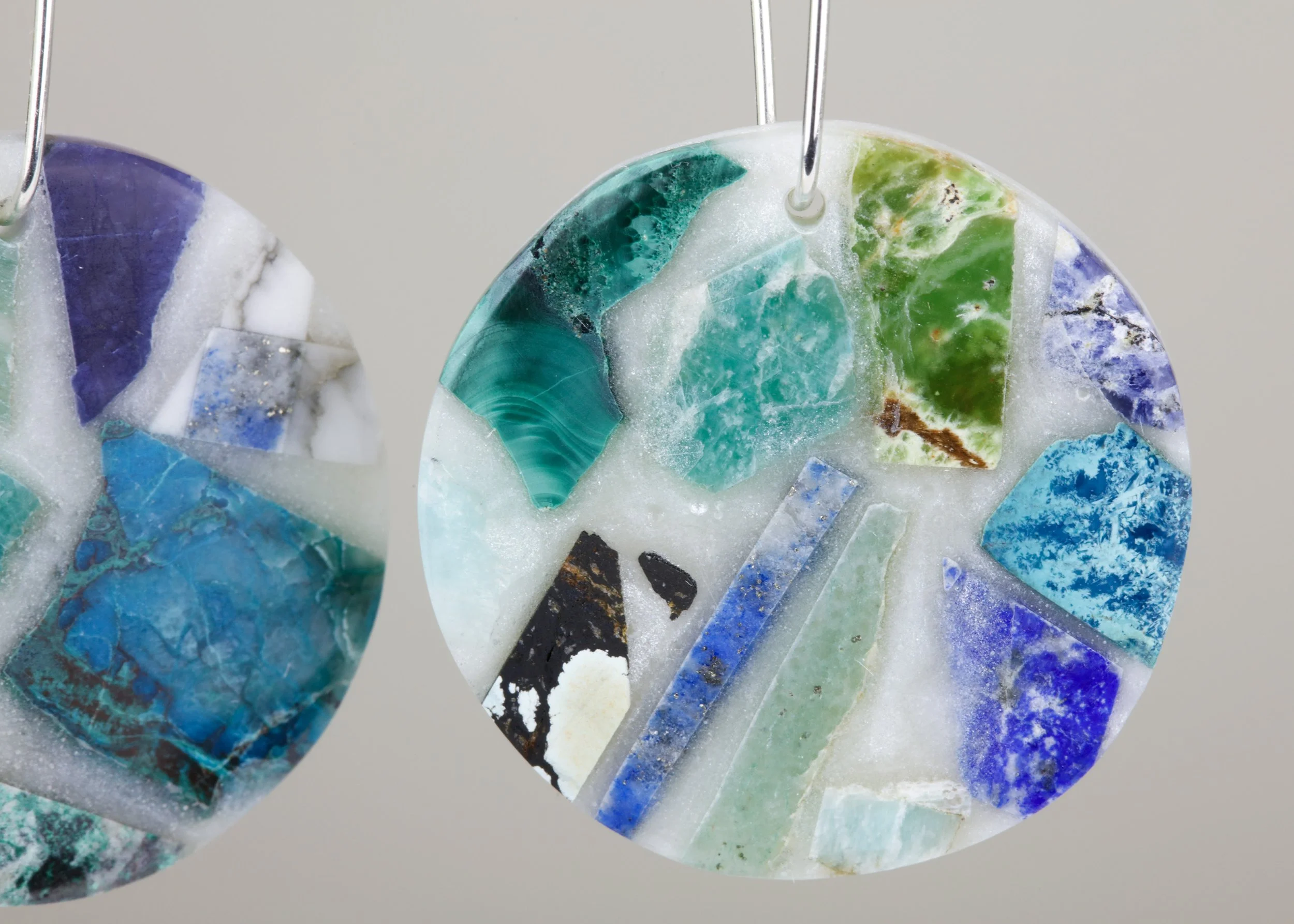 Semi-precious mosaic earrings with sterling silver and blue natural stones like sodalite, chrysocolla, amazonite, and lapis lazuli; closeup view of product