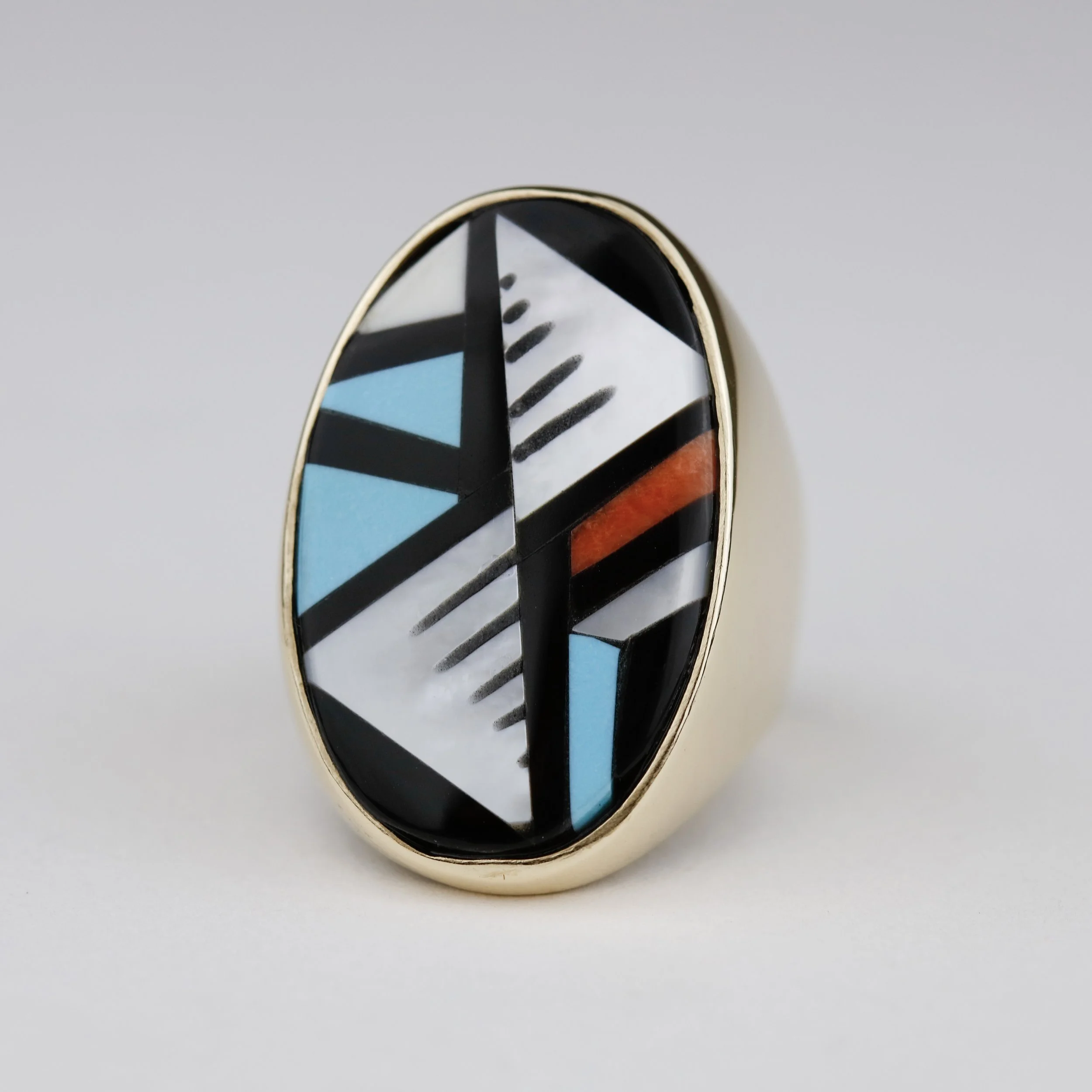 After inspecting the ring and talking with my client to get his approval, we decided to do a full recut of all of the stones, which had become thin and not very durable over time. When my client first saw his ring, he said, "It looks better than when