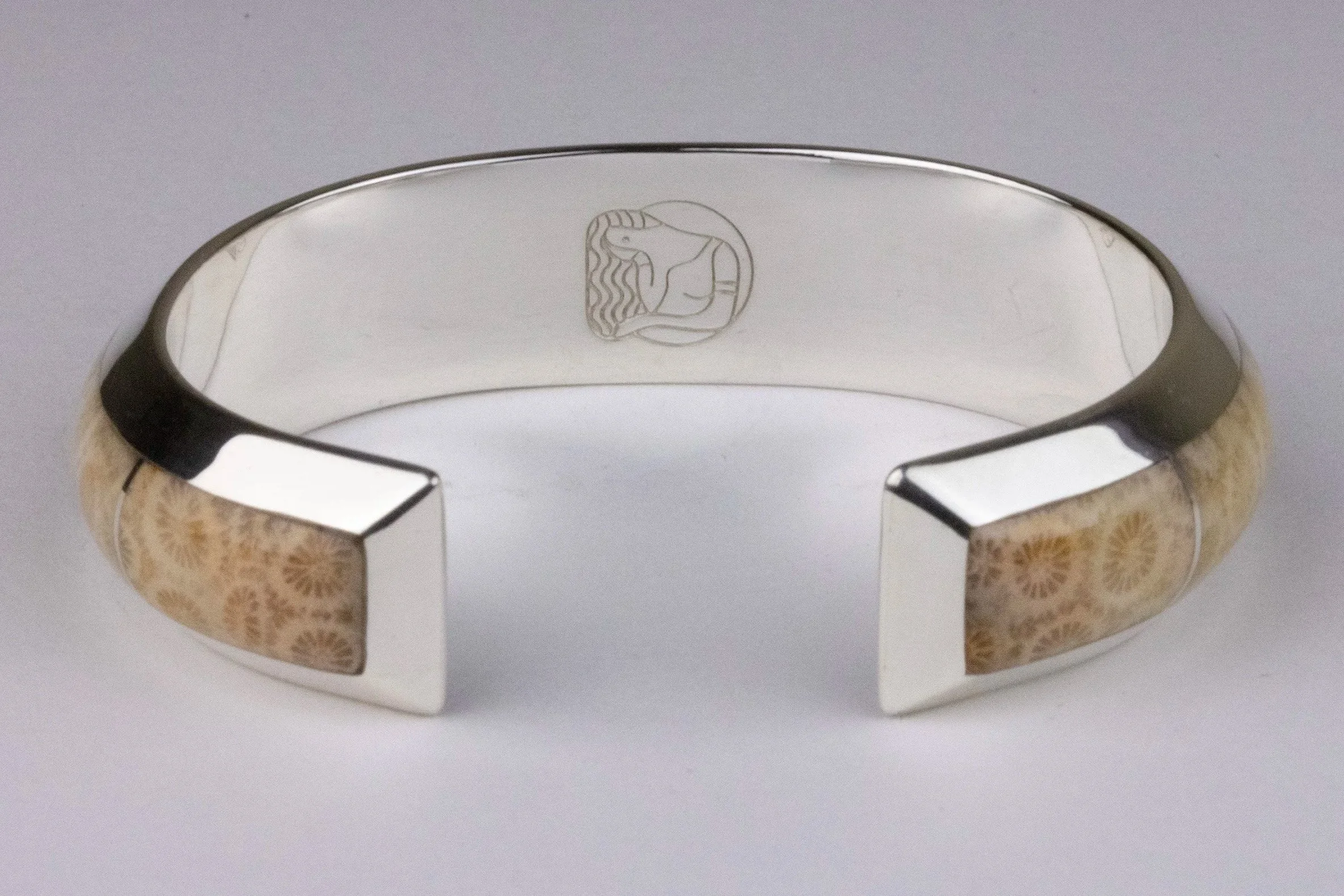 Agatized coral cuff bracelet showing Caitlin Albritton Jewelry makers mark, back view