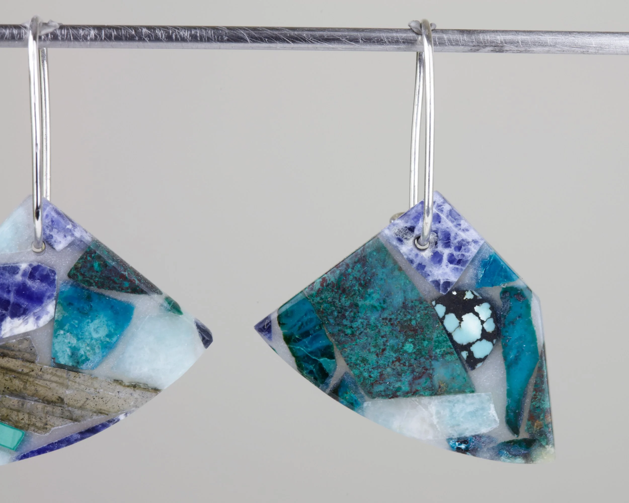Mosaic earrings with semi-precious blue stones like amazonite, turquoise, chrysocolla, and sodalite; closeup view of product