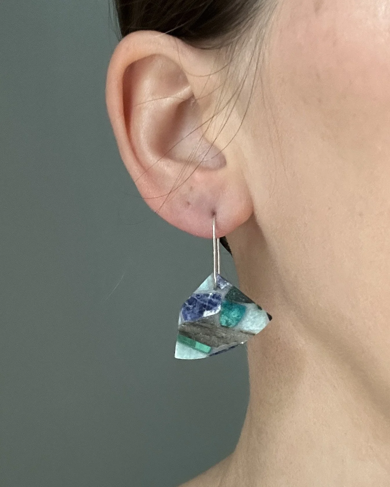Blue natural stone mosaic earrings with sterling silver; modeled by the jewelry artist Caitlin Albritton for scale