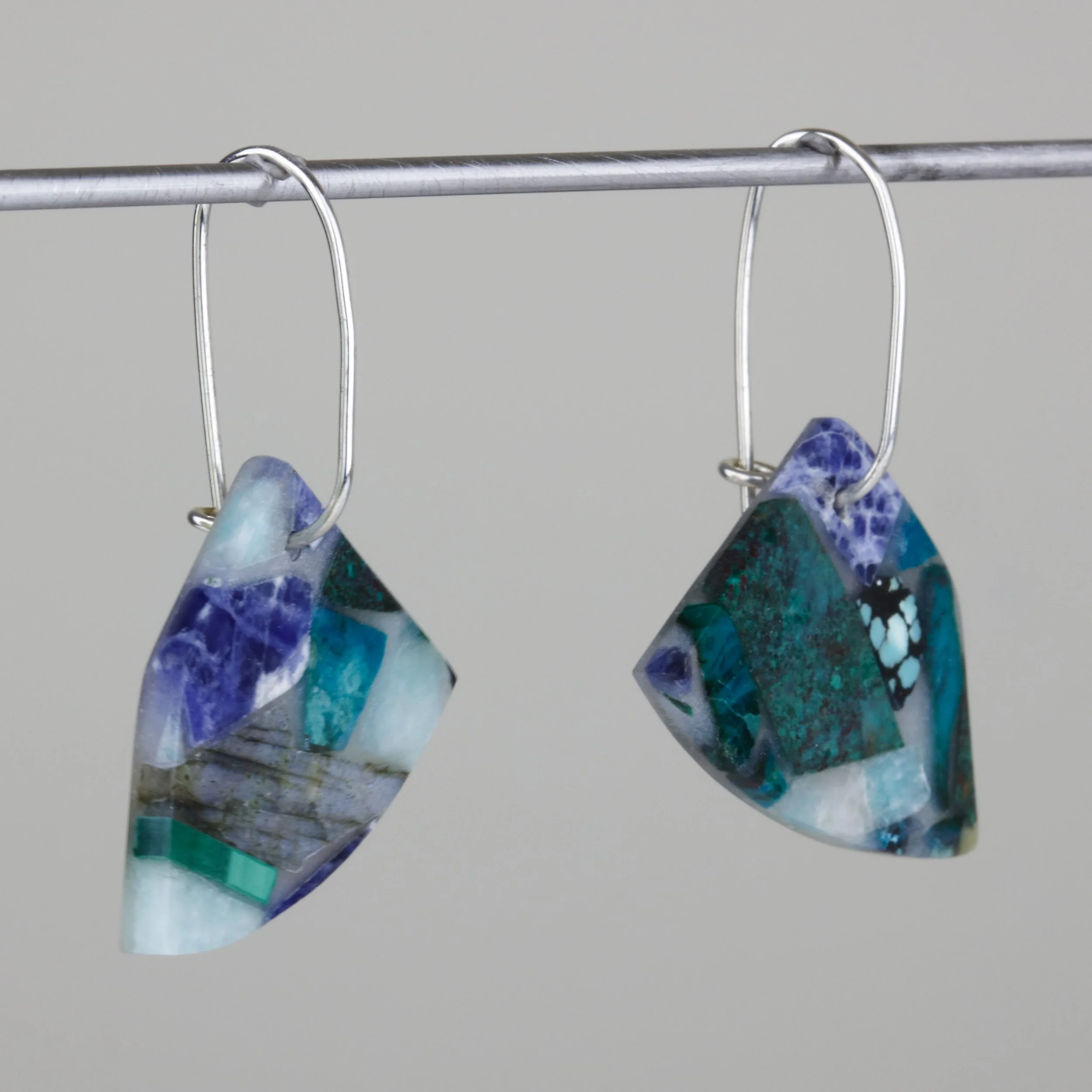 Mosaic earrings with semi-precious stones like amazonite, chrysocolla, sodalite, and others; side view of product