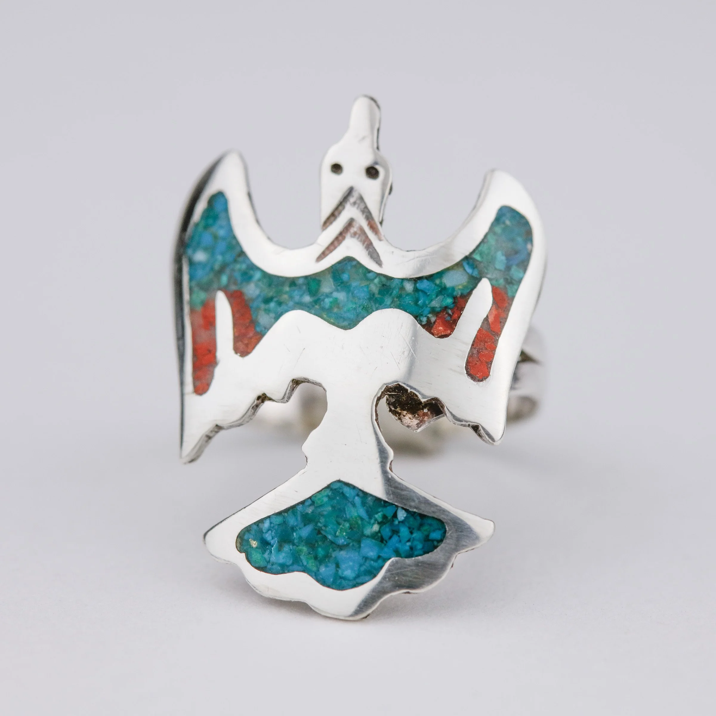 I removed the broken and off-colored stones before re-inlaying them with turquoise and coral chips.