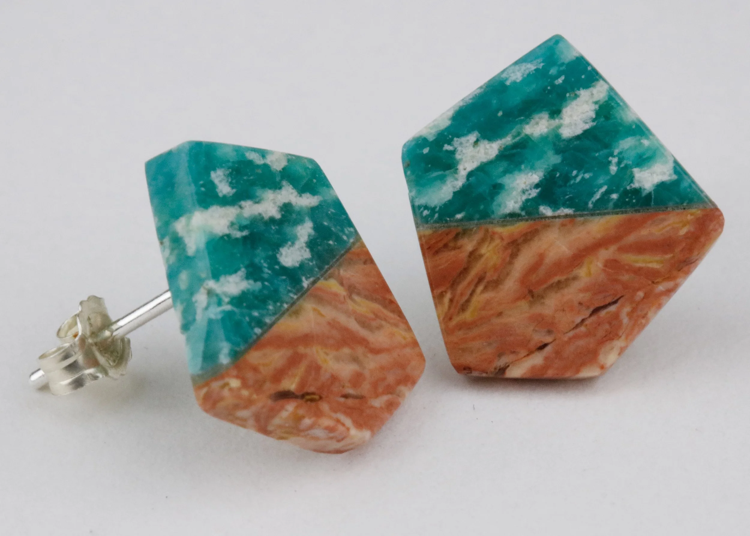 Stone intarsia stud earrings with perthite, howardite, and sterling silver in geometric shape; side view of product