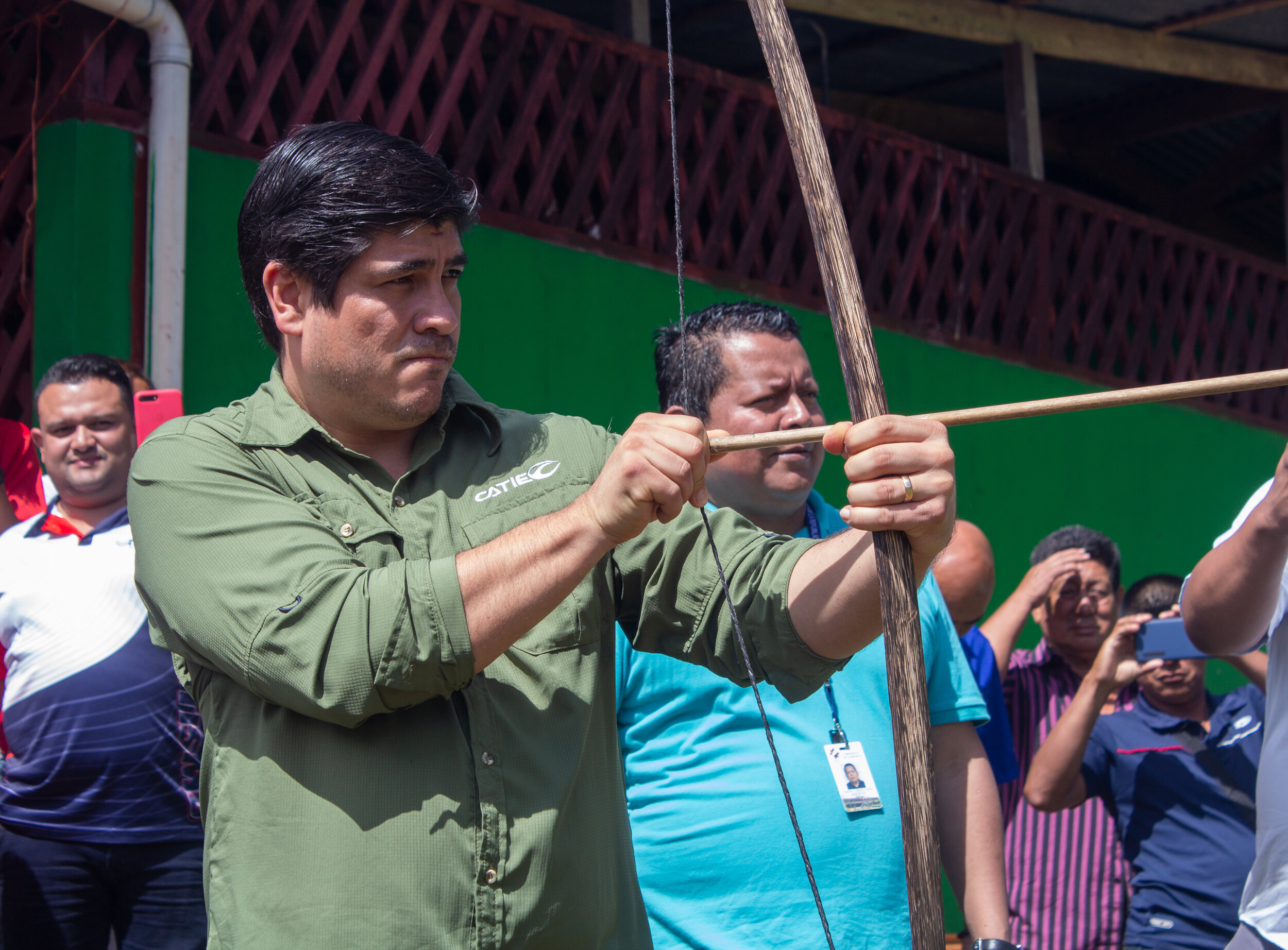 President of Costa Rica Carlos Alvarado shooting a bow and arrow at the regions first indigenous games in Talamanca, Costa Rica
