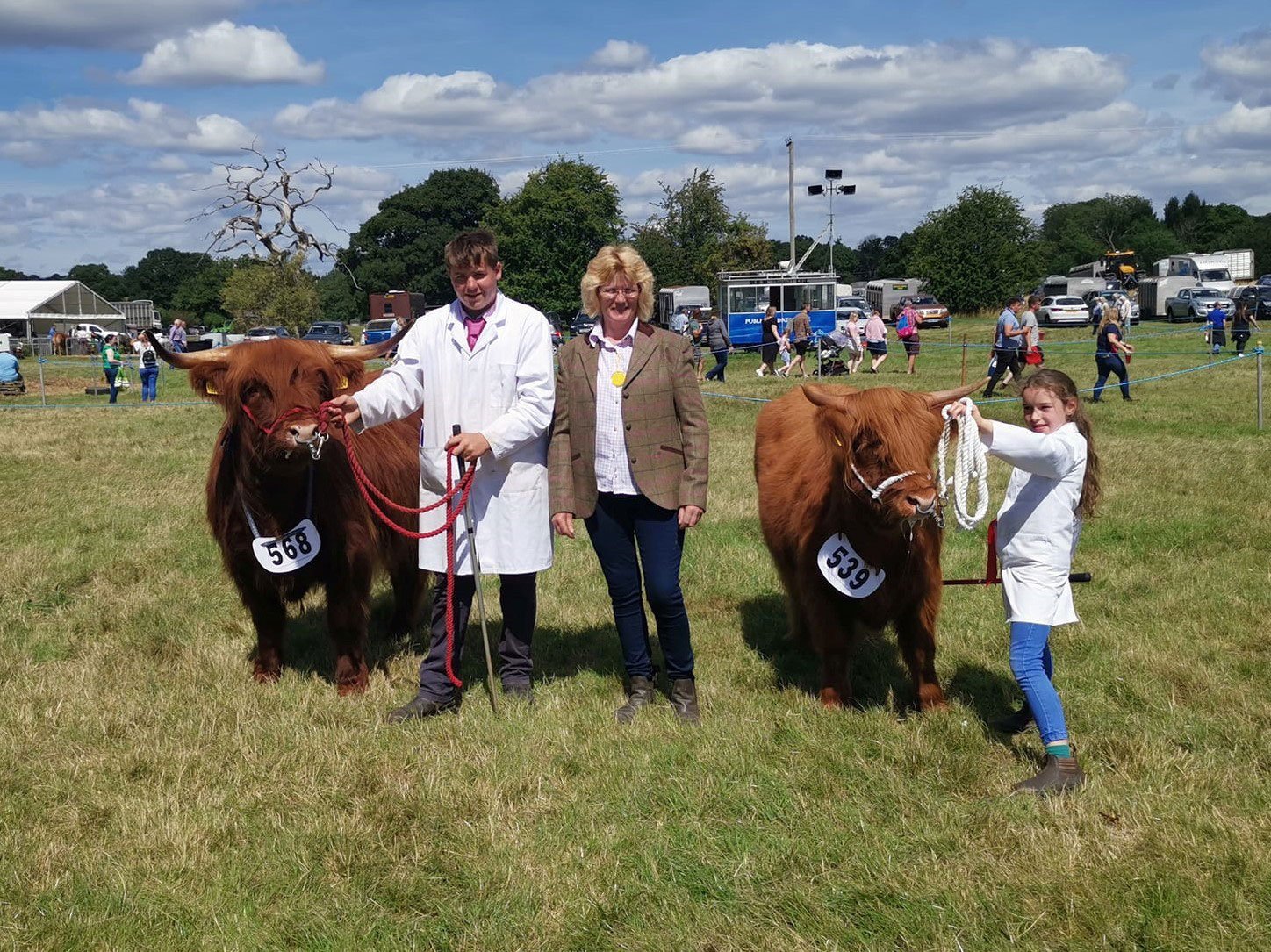 Young handlers champion Eirian Rowlands and reserve Louis Jordan, with judge Annie Perkins at the Oswestry Show