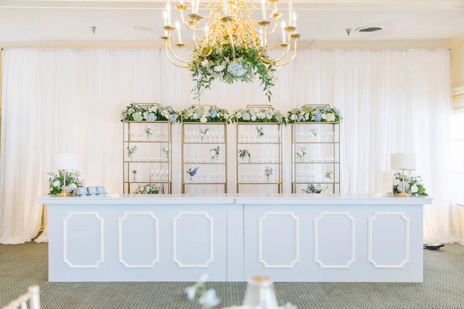 Detailed white custom event bar and coordinating display shelves