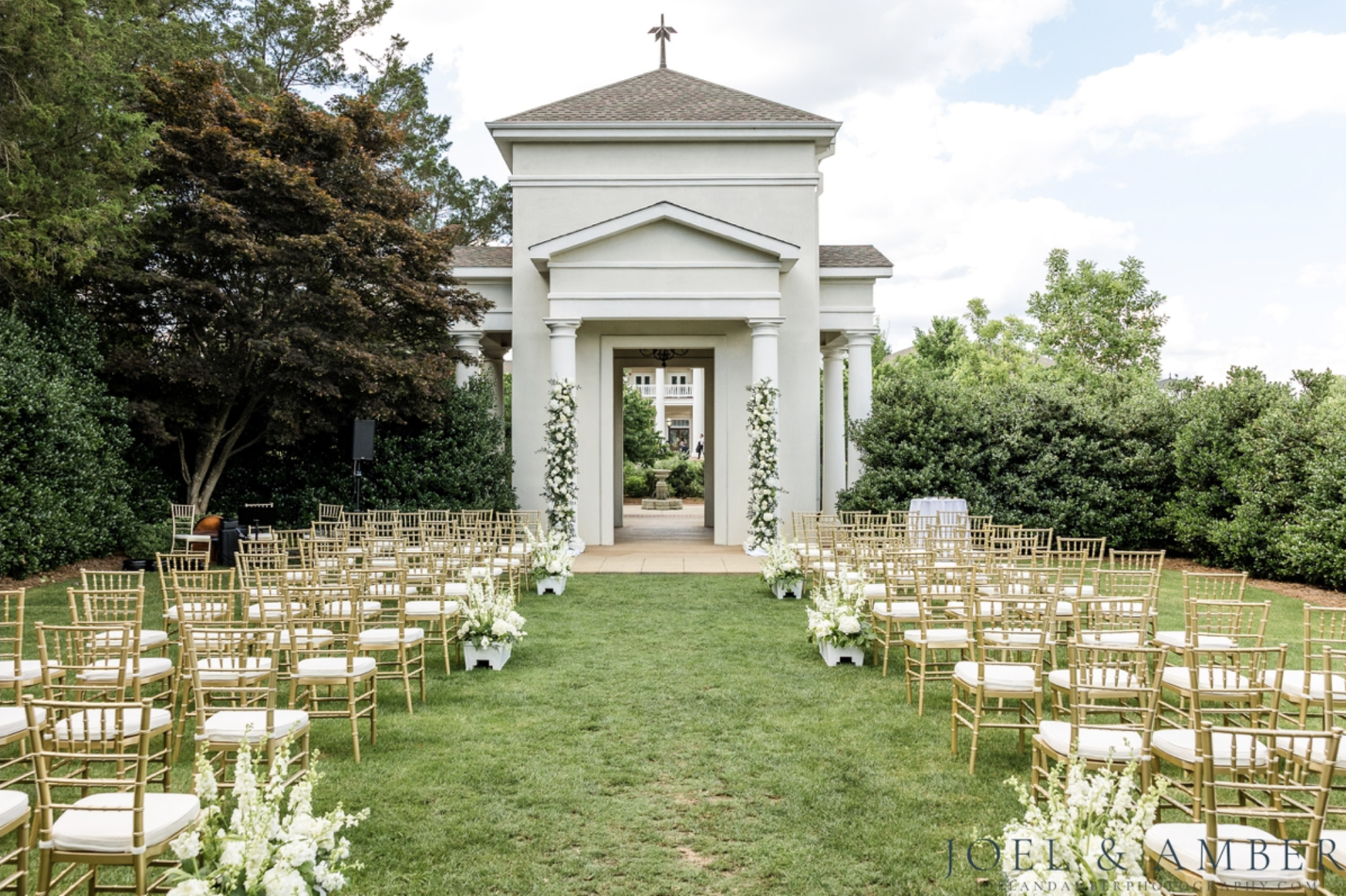 Garden ceremony arranged with gold Chiavari chairs