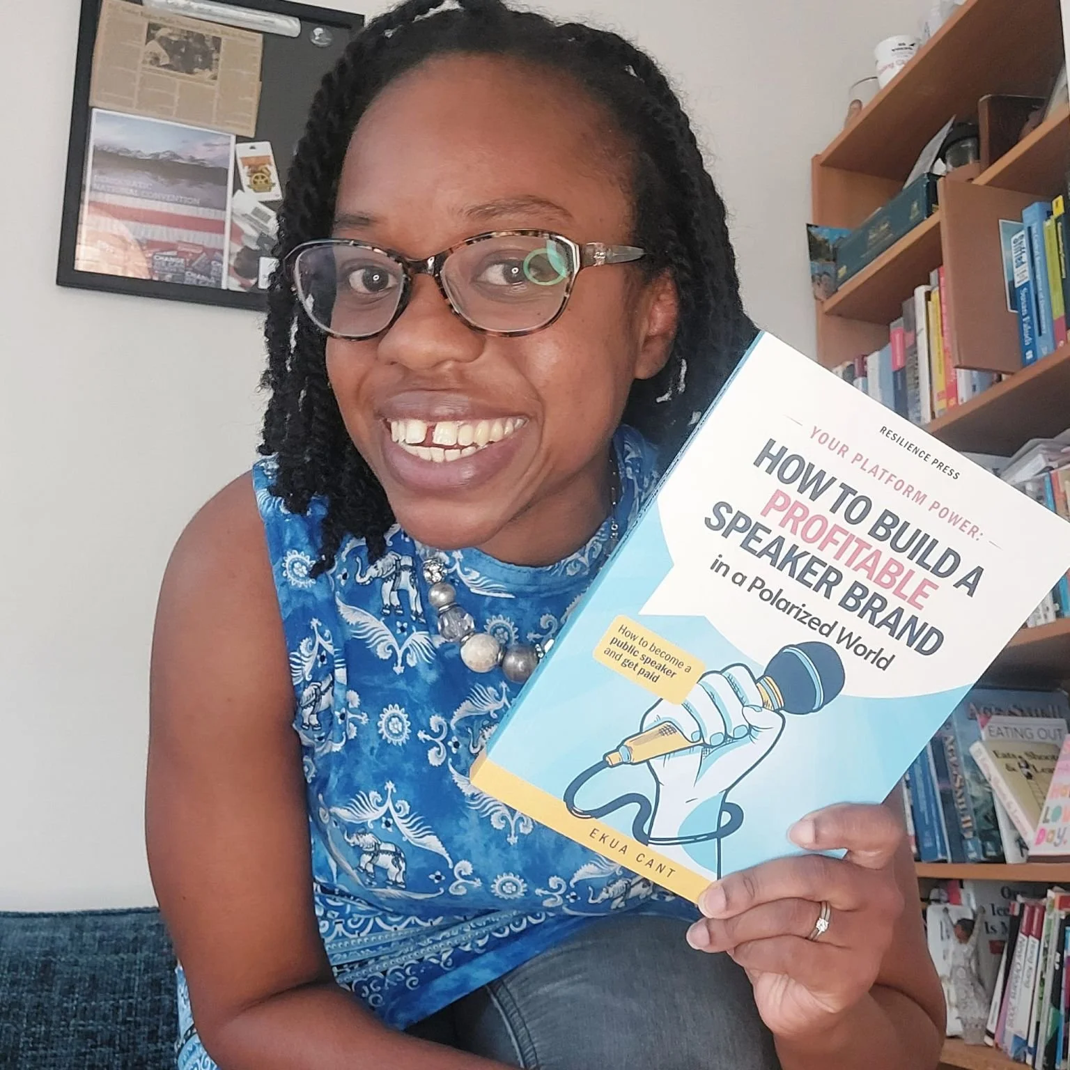 Ekua Cant holding her book, Your Platform Power: How to build a profitable speaker brand in a Polarized World.