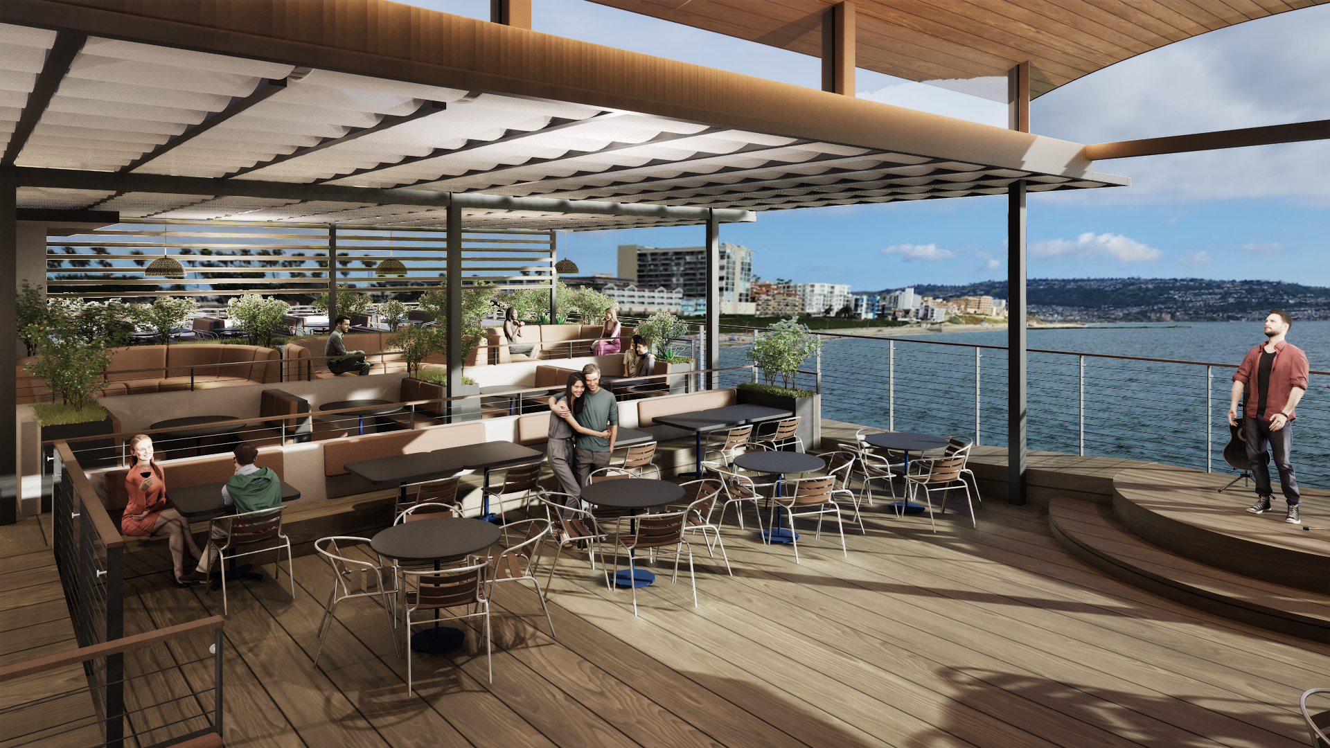 Outdoor rooftop bar overlooking the water with seating and a stage for live performances.