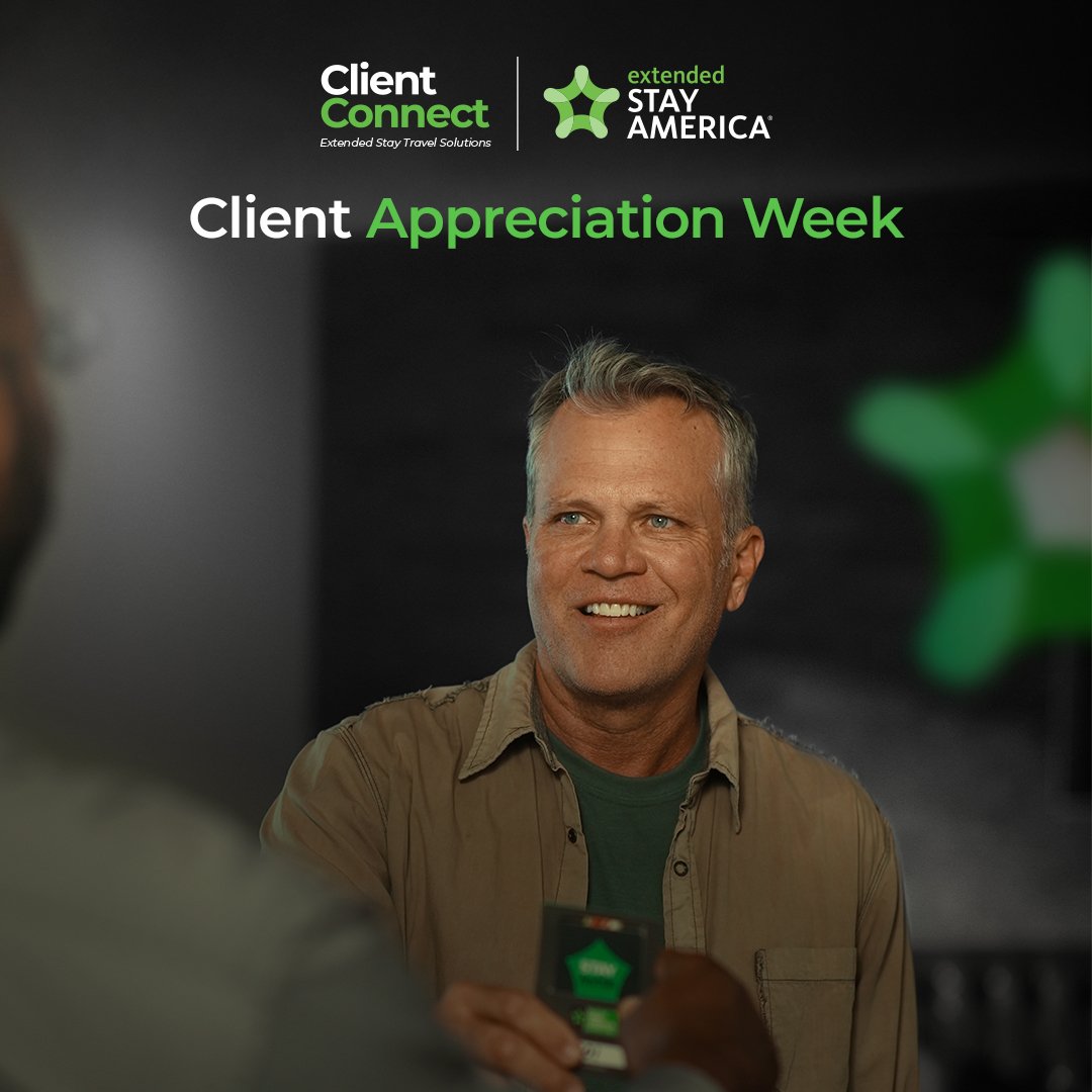 A smiling man participating in a Client Appreciation Week event organized by Client Connect and Stay America, with a backdrop displaying the event details and logos.