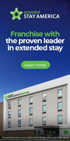 Advertisement for extended stay America featuring a hotel building with the company's logo and a call to action button labeled 'Learn more'