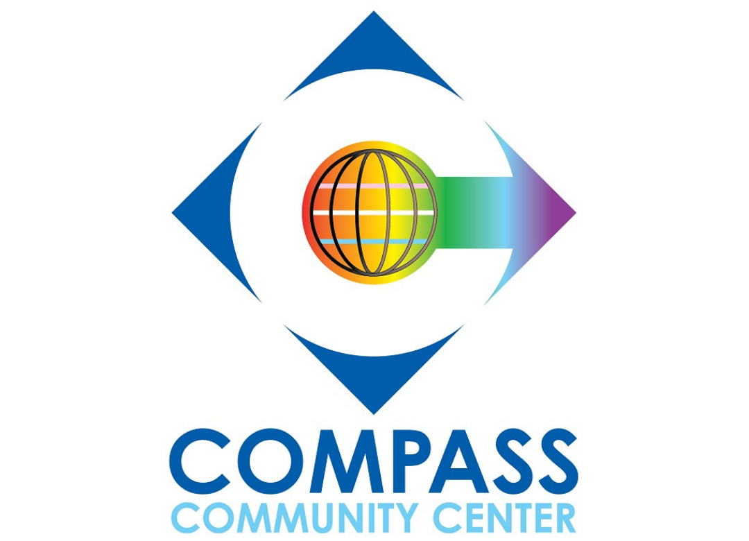 Logo of COMPASS Community Center with a globe, arrow, and text.