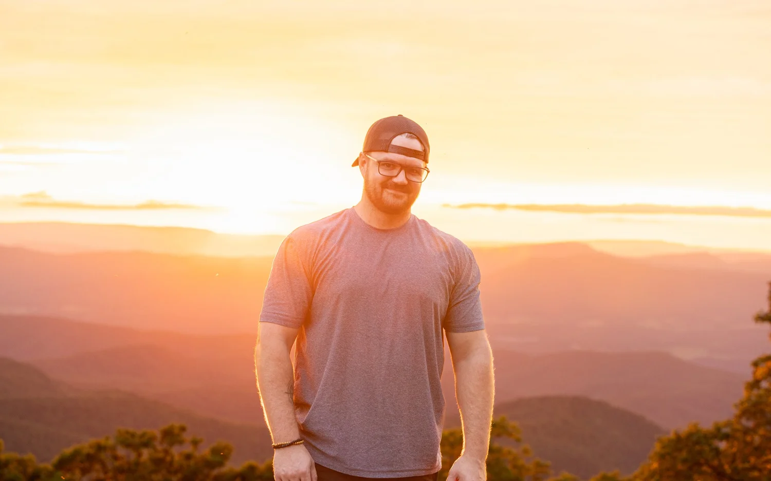 Zach Plank at sunset in a mountainous landscape