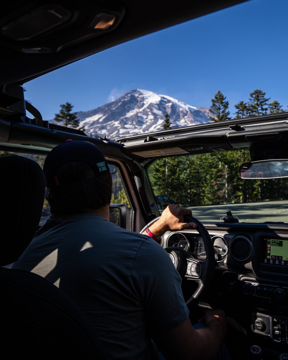 Looking through a Jeep windshield at Mount Rainier