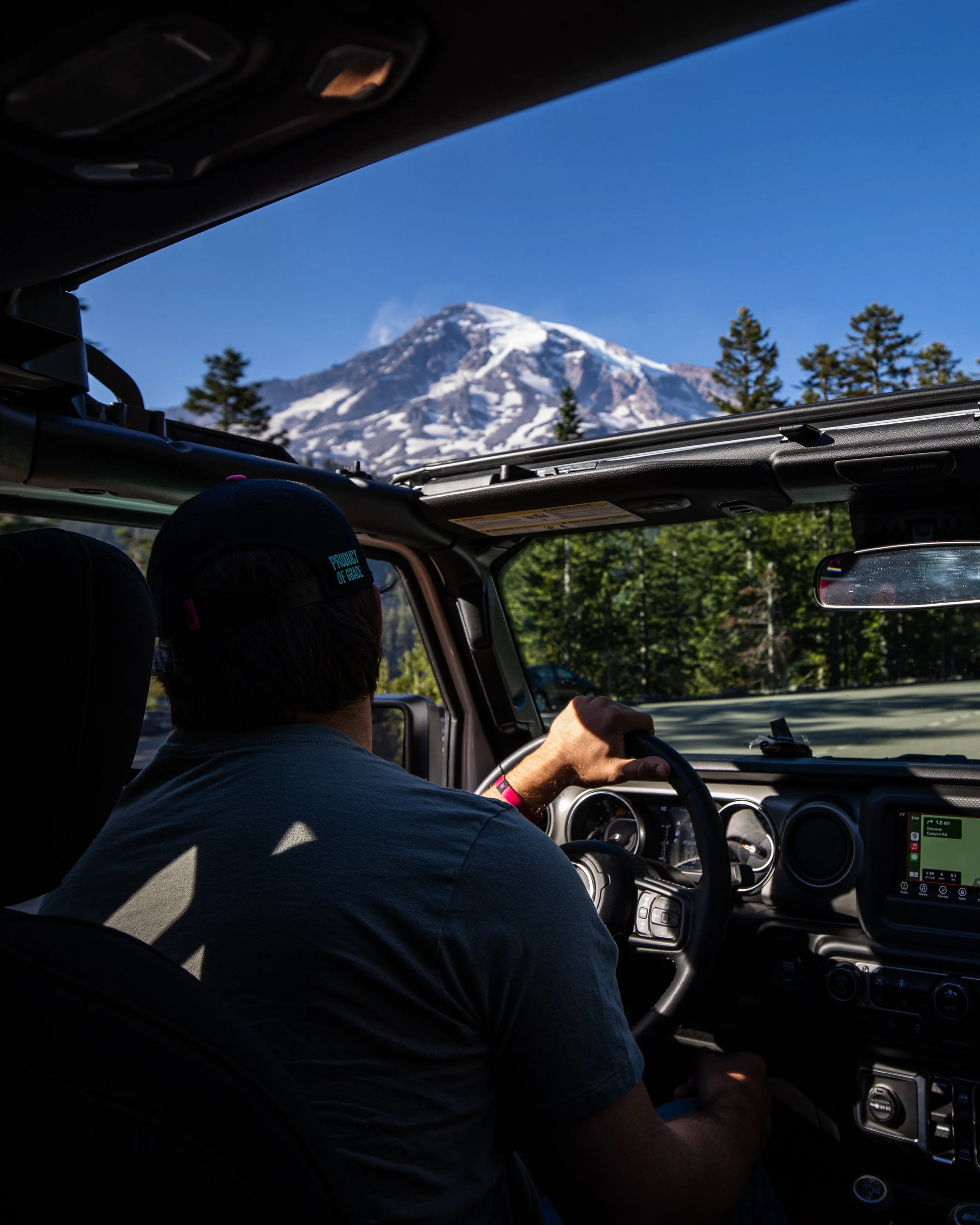 Looking through a Jeep windshield at Mount Rainier