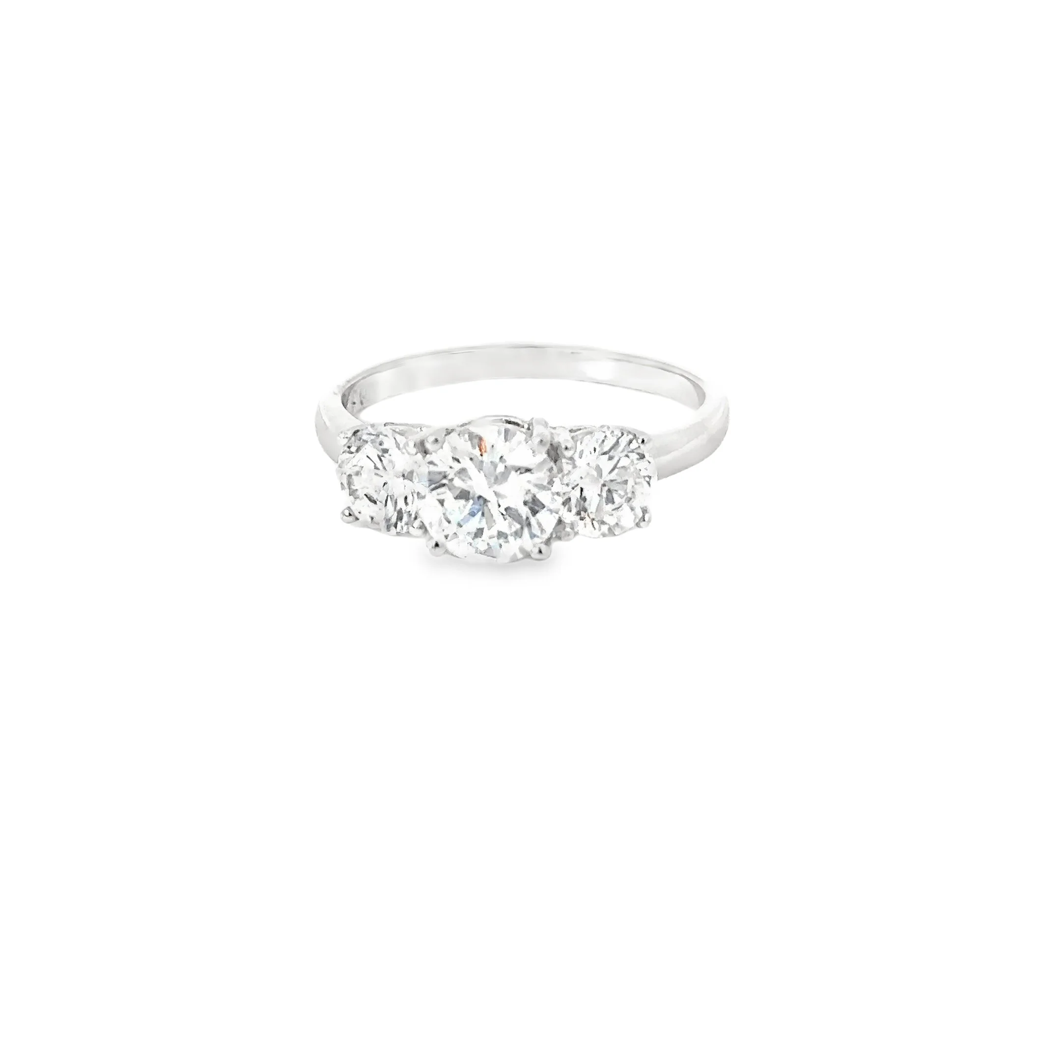 Silver ring with five sparkling diamonds arranged in a row.