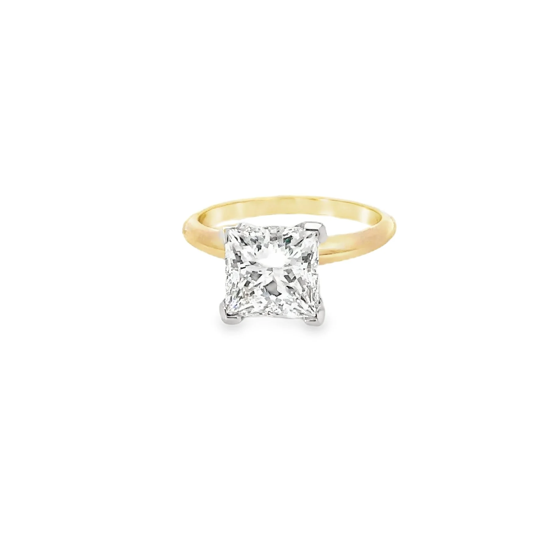 Gold ring with a large square-cut diamond solitaire setting.