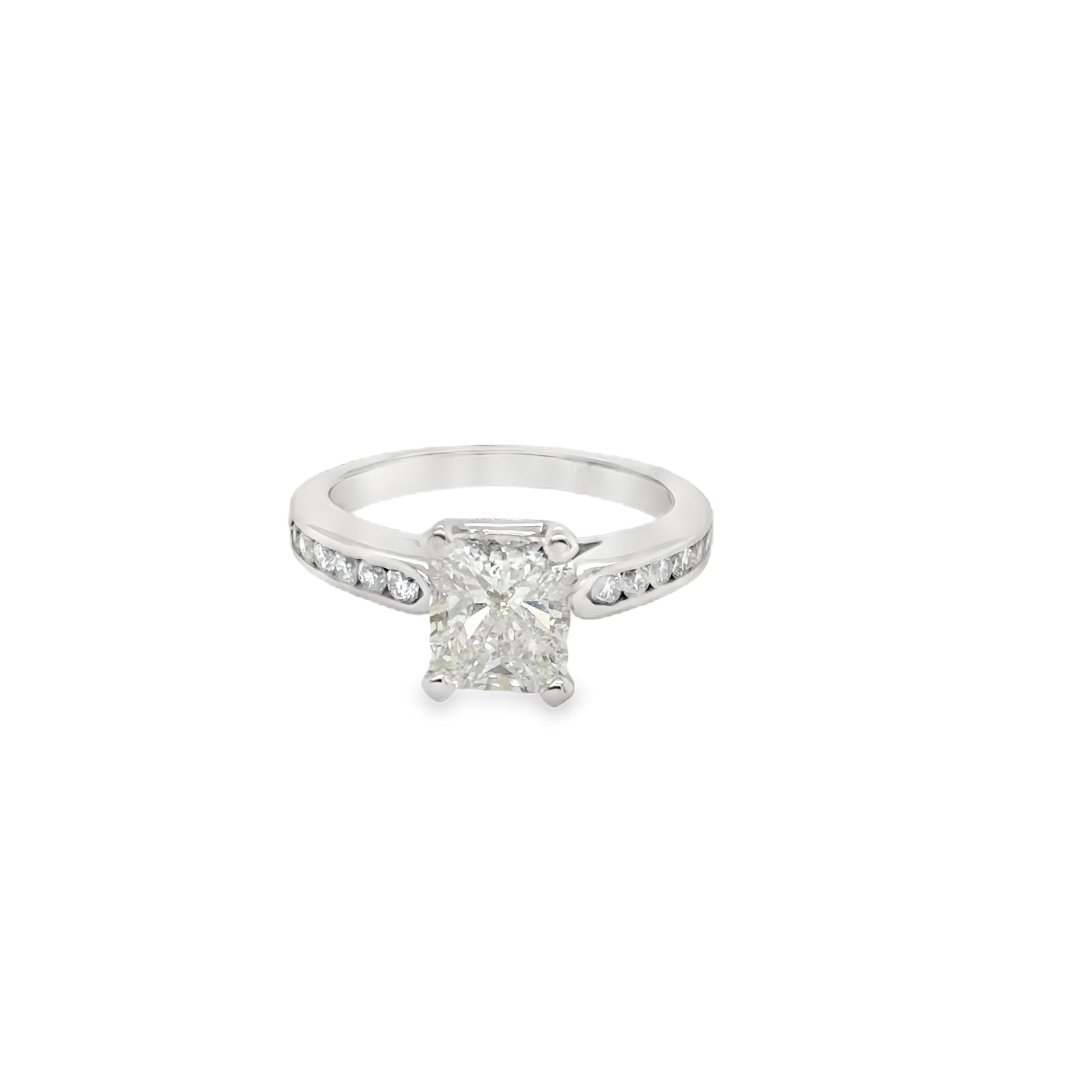 Silver engagement ring with a large square-cut diamond in the center and smaller diamonds along the band.