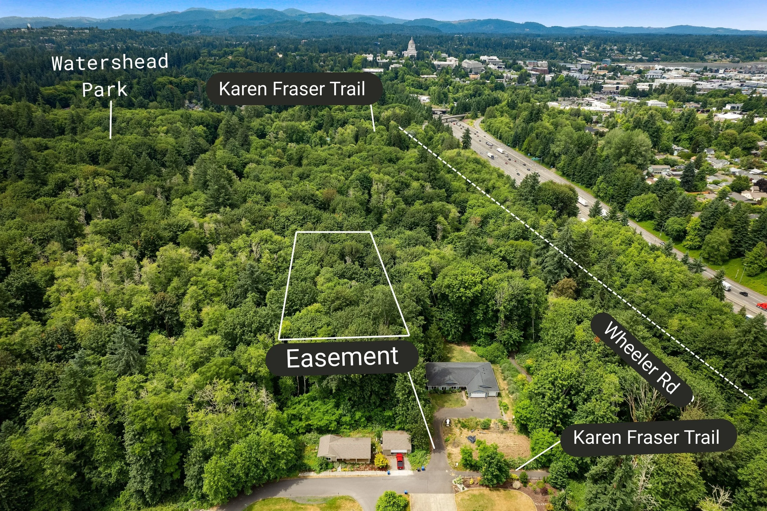 Drone shot of a piece of land showing the easement call out about Karen Fraser Trail Wheeler Road and watershed Park in Olympia, Washington