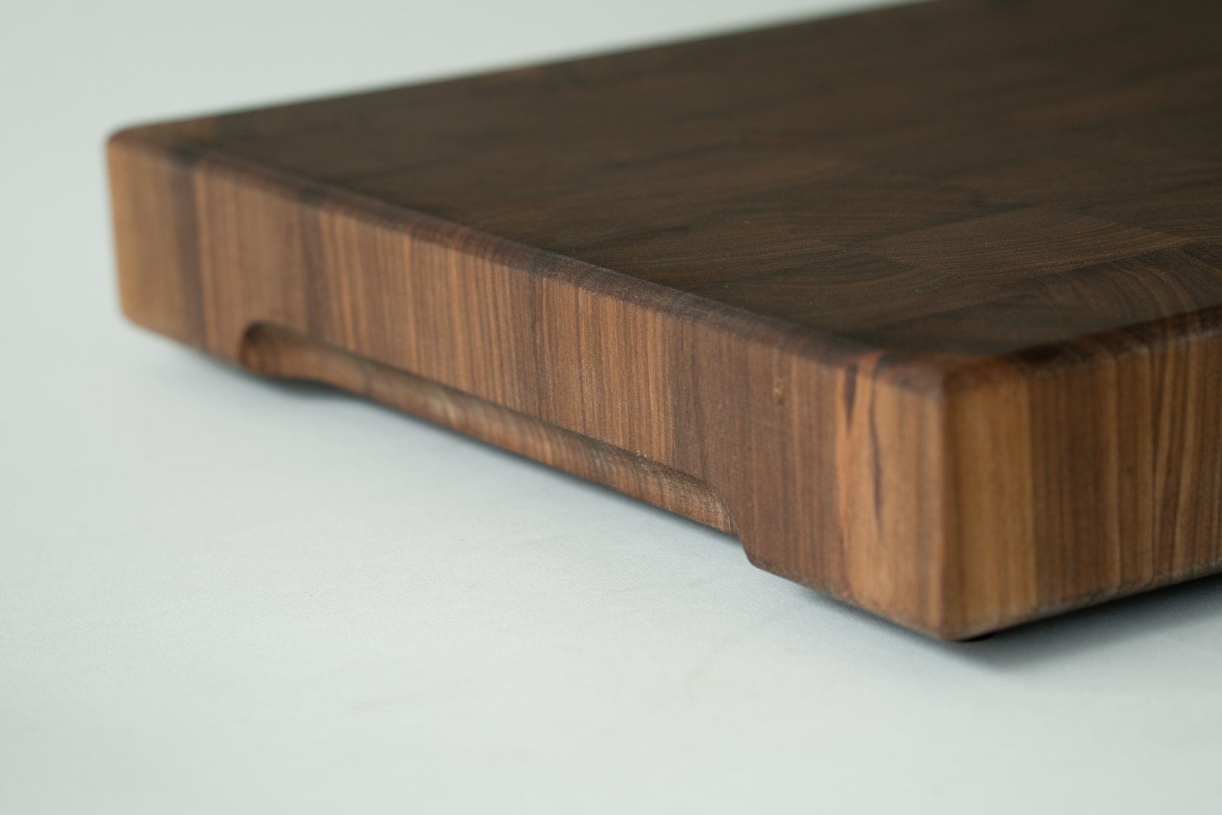 a cherry end grain cutting board made from walnut wood
