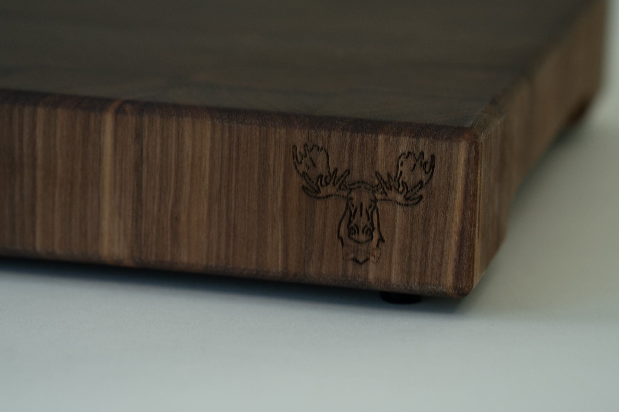 a cherry end grain cutting board made from walnut wood