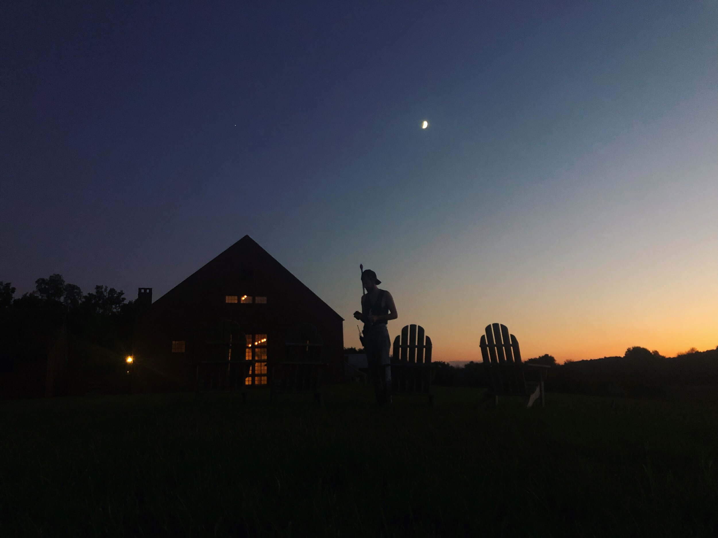 Staatsburg, NY. A crew member wraps his equipment at dusk.