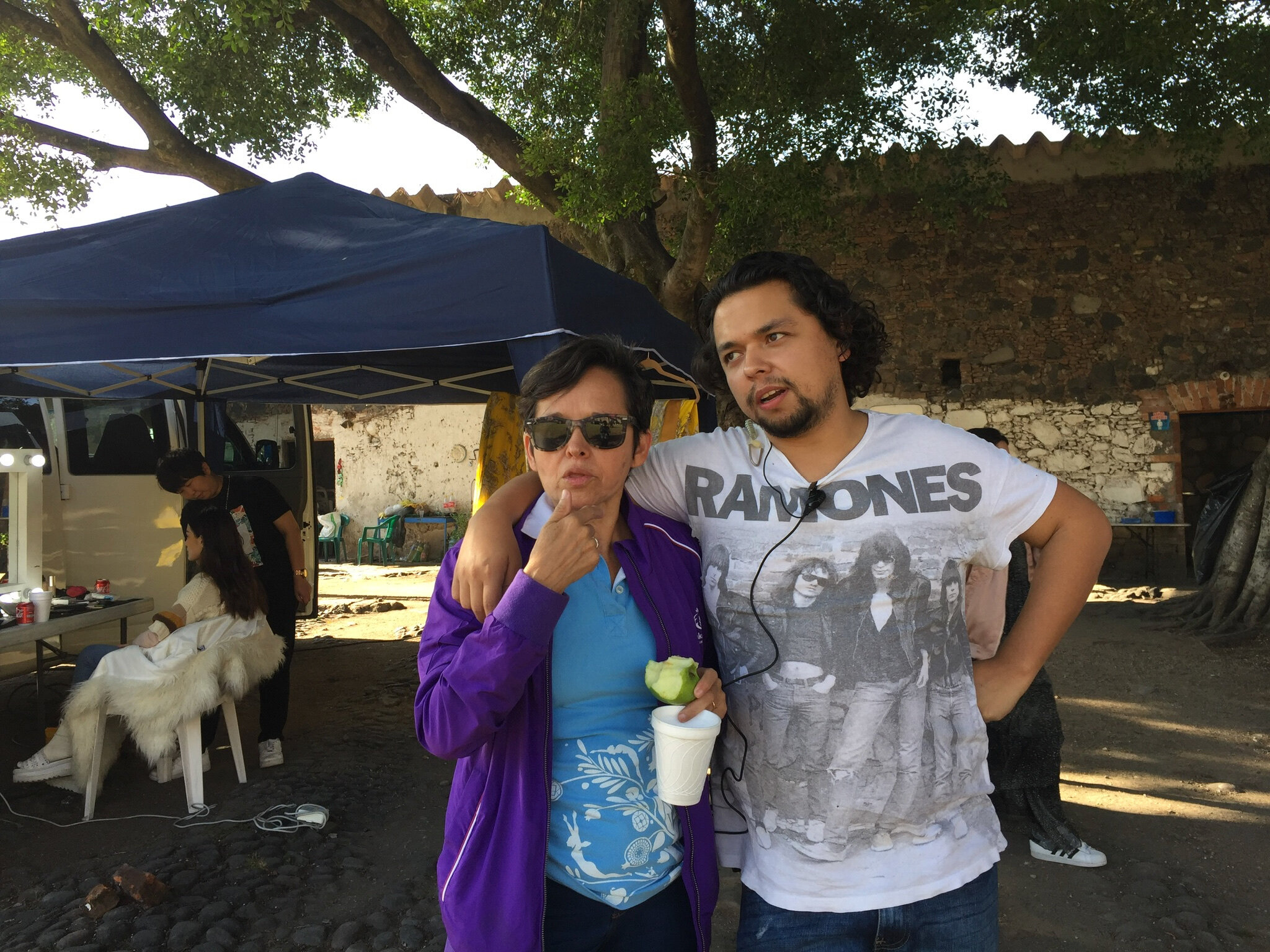 Morelos, Mexico. Assistant Director and Producer tease each other on set (all in good fun).