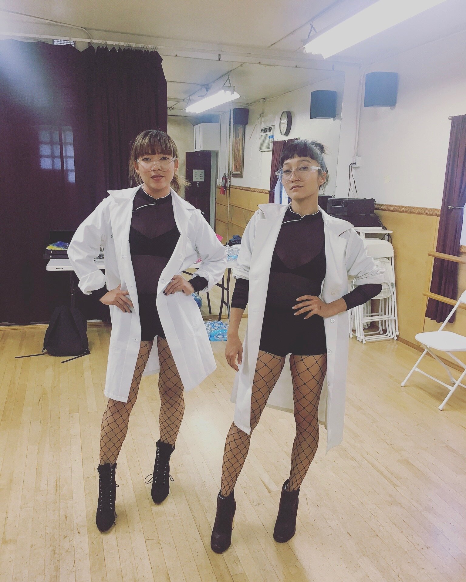 Los Angeles, CA. Fierce dancing duo showing off their costumes at a fitting.