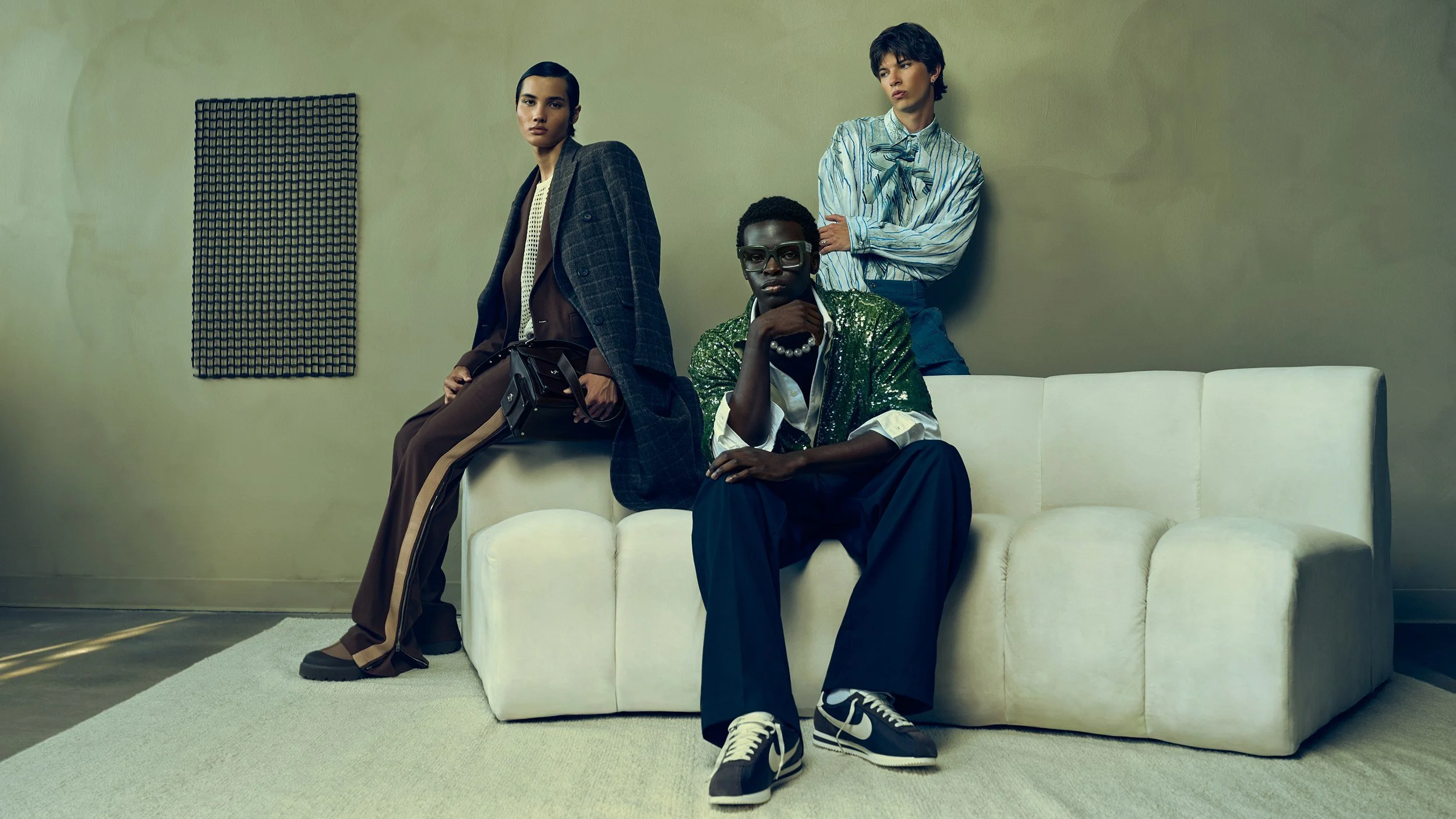 Editorial high fashion test with stylist ToR. Sculptural poses, accessory-forward styling, neutral studio architecture and controlled window light. Editorial, campaign and lookbook oriented. Models: Zion, Henry, Christian.