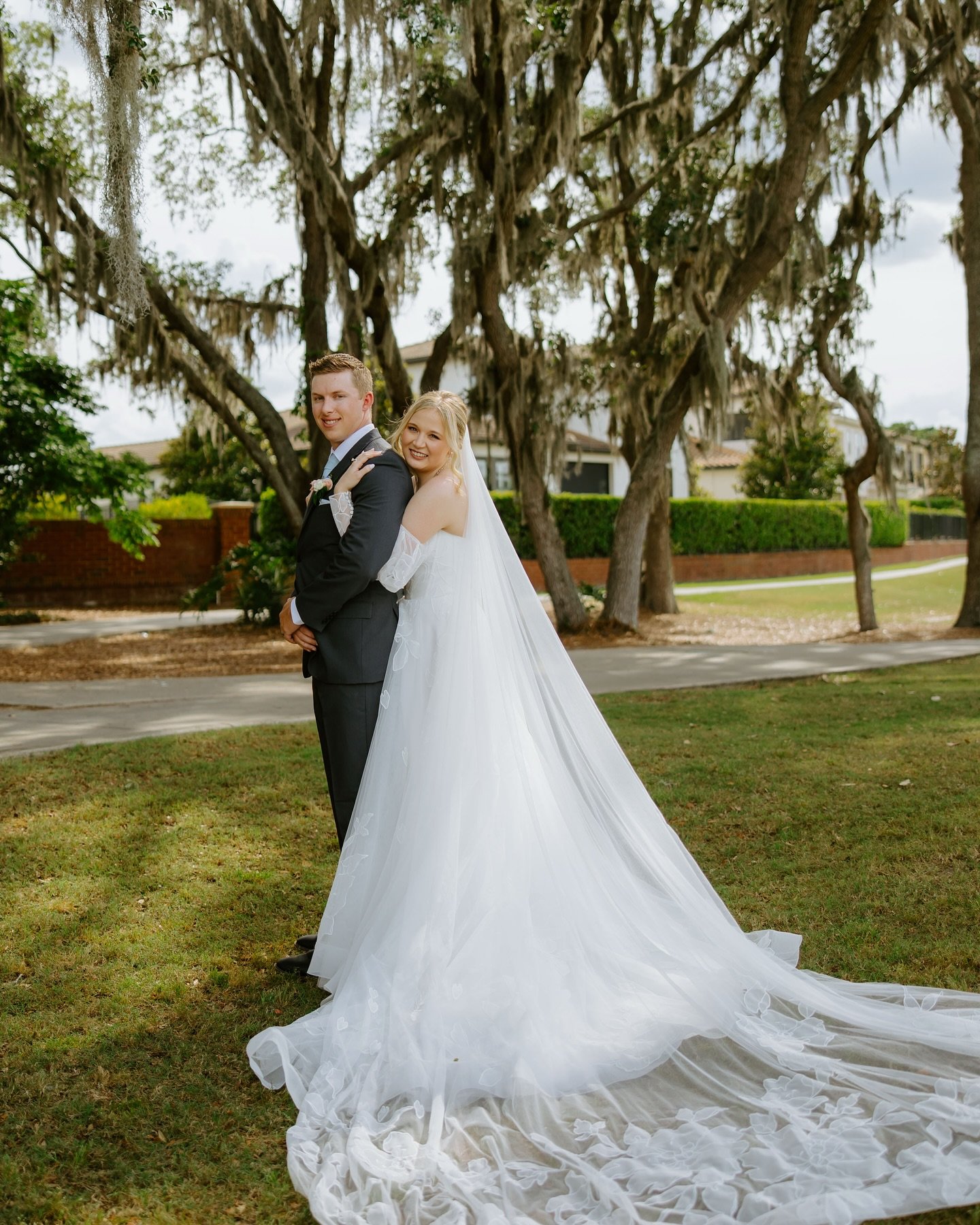 Sarah + Nick | 05.03.25 💍✨

Our gorgeous bride Sarah looked like a vision in one of our most loved gowns from Bridal Gown Studio &mdash; featuring romantic off-the-shoulder sleeves, delicate floral appliqu&eacute;, and a breathtaking train that brou