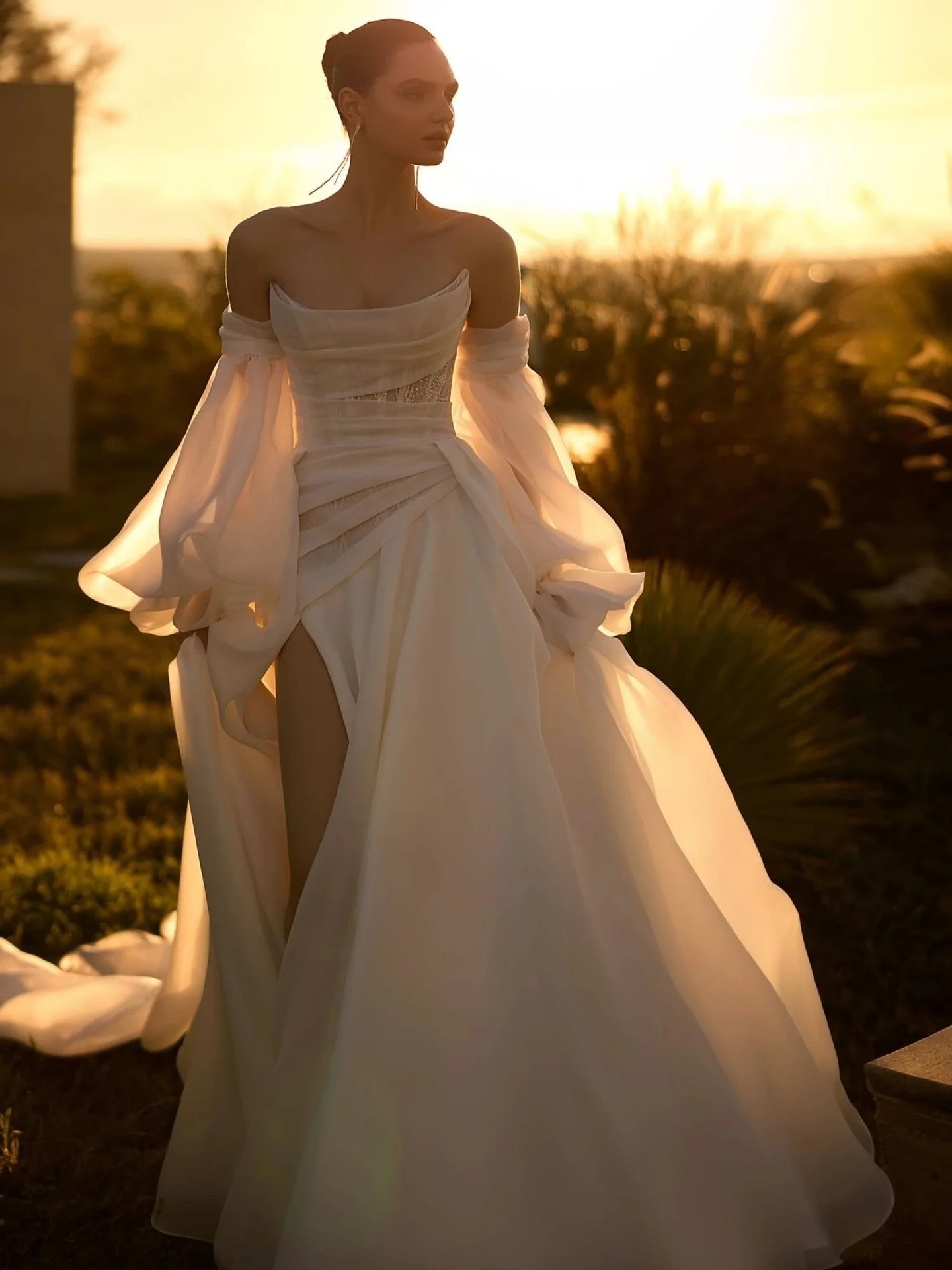 Luxurious minimalism meets modern romance 🤍
An ivory A-line gown crafted in textured glitter organza. 
Complete with a draped corset, airy train, and detachable sleeves for the perfect touch of drama.

#bridal #bridalinspo #wedding #weddingdresses #