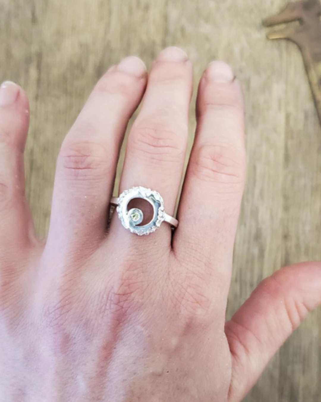 open barnacle peridot ring worn.png