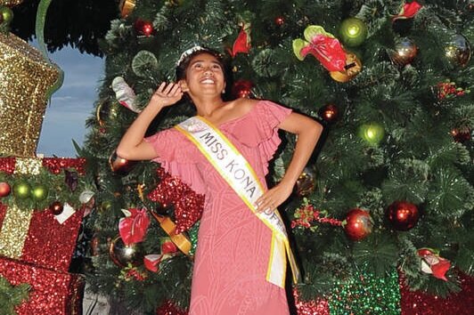  Young Miss Kona Coffee, Diamond Kawaauhau, performs at the Kailua Village Christmas Tree Lighting Ceremony Friday at Emma Square. (Laura Ruminski/West Hawaii Today) 