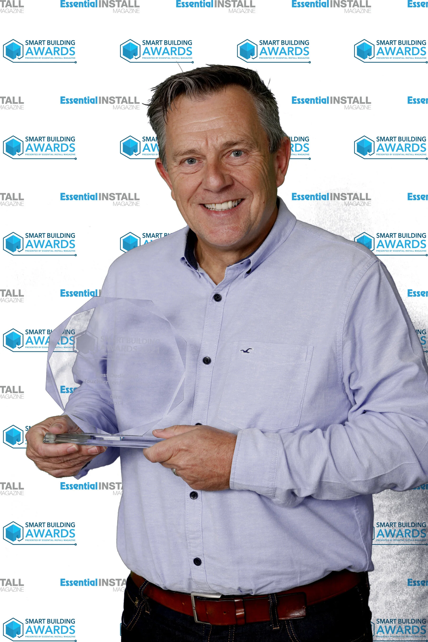 Richard Udell - Project Manager at Gira UK collecting awards trophy