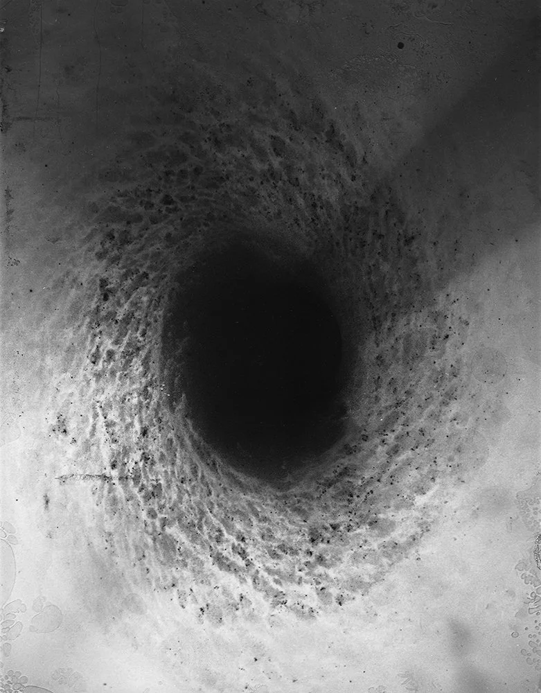 Interpretation of a black hole.
Black Hole #221 - Cliche Verre and Collage - 3 hand altered acrylic and acetate sheets directly exposed to a 4x5" sheet of B&W Fomapan 100 Film.