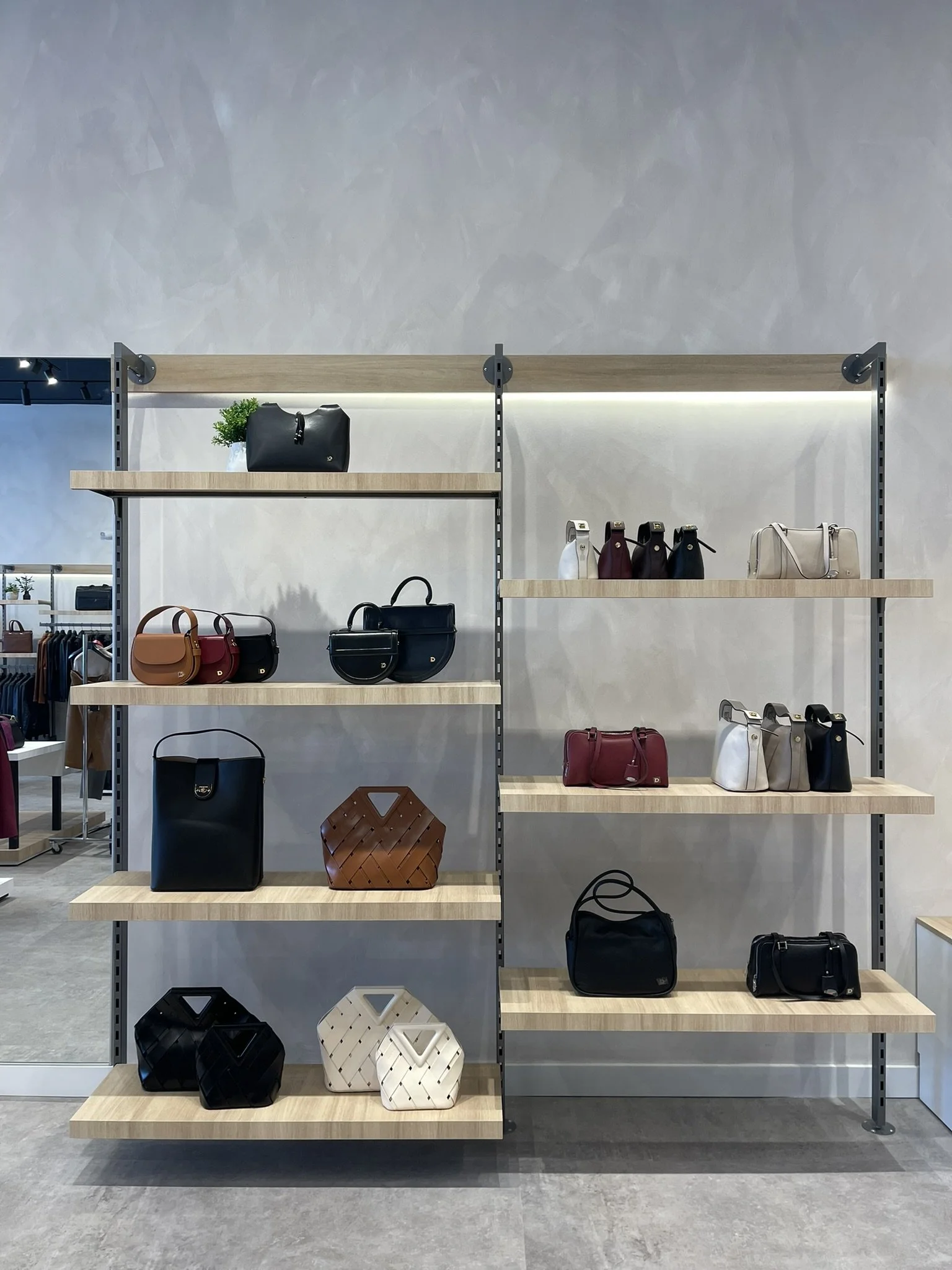 Feature table display at Danier highlighting key products through visual merchandising techniques that guide customer attention