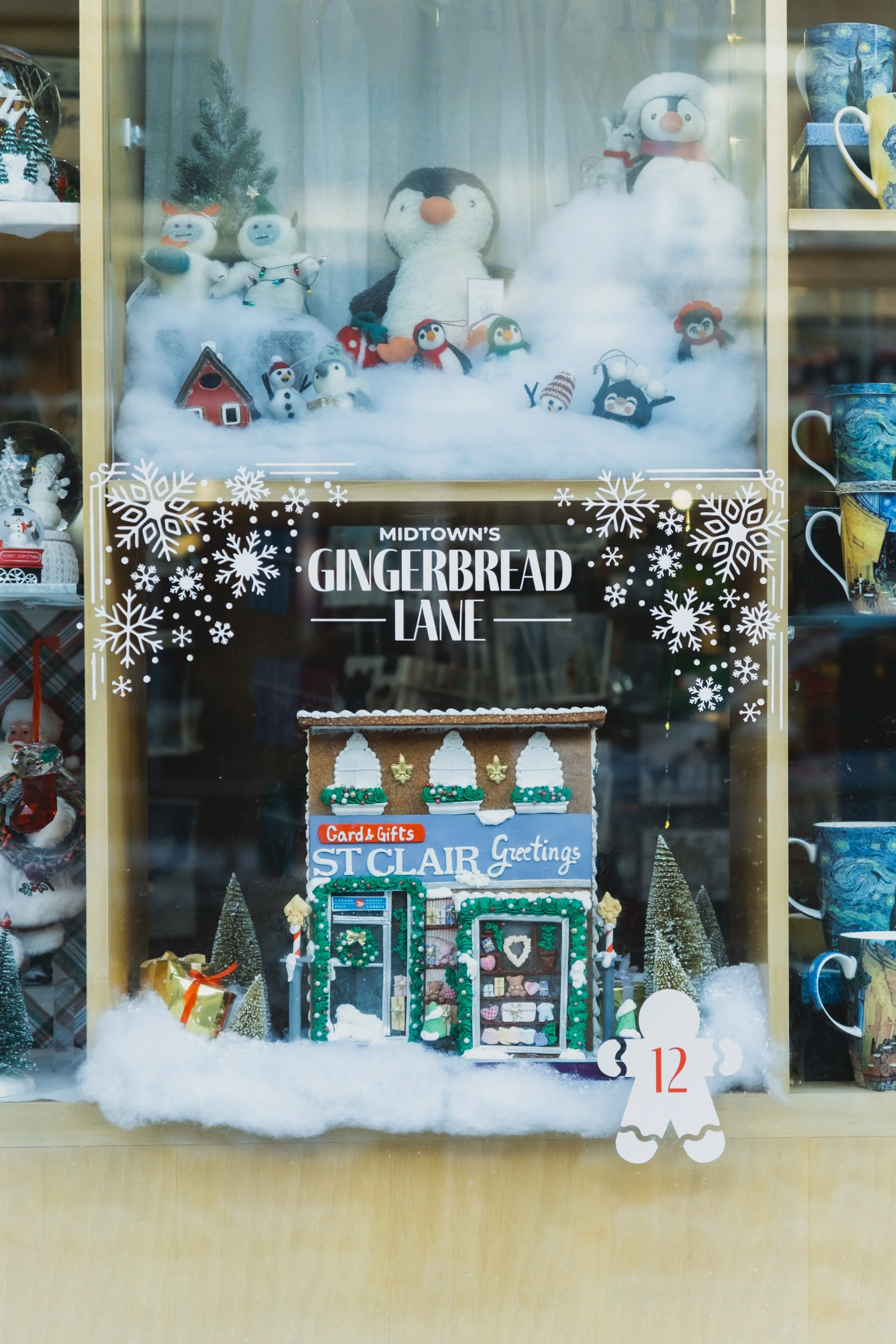 Gingerbread house holiday display installed inside a restaurant as part of the Yonge St. Clair BIA Gingerbread Lane visual merchandising program.