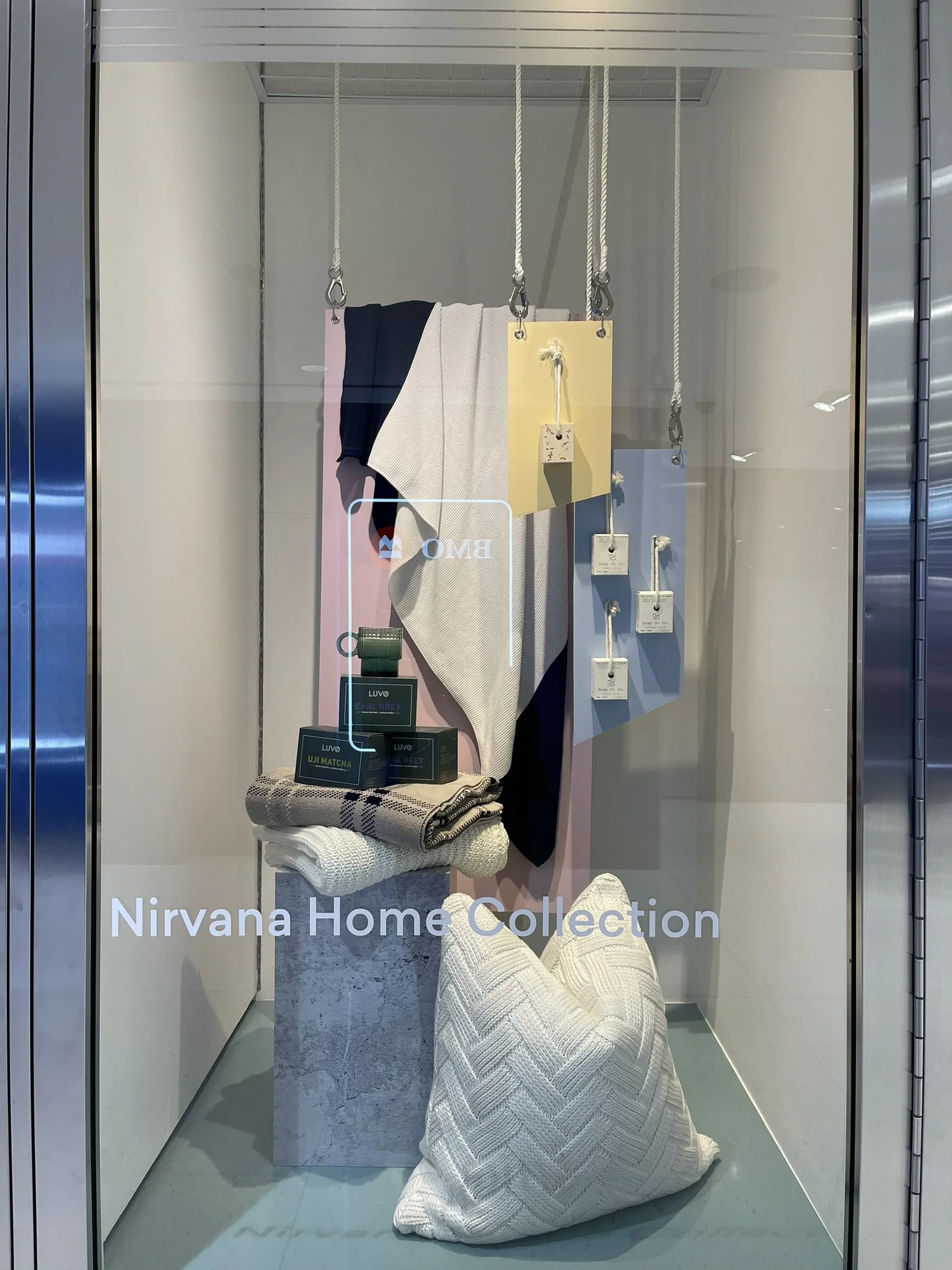 Home décor window display for Nirvana Home Collection at Manulife Centre, presented within a curated visual merchandising program supporting diverse shopping centre tenants.