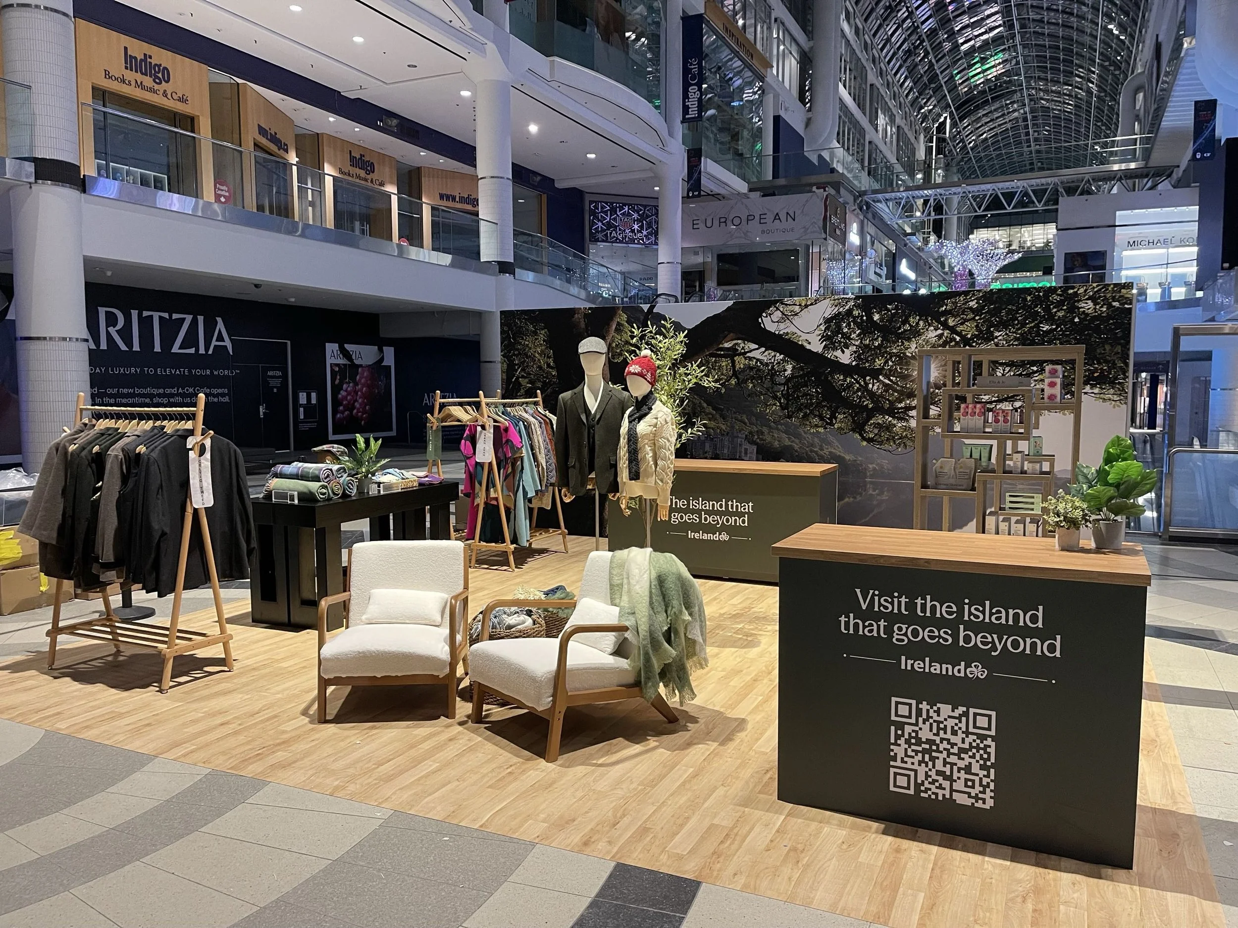 Visual merchandising and layout strategy for the Enterprise Ireland retail pop-up at Toronto Eaton Centre presenting multiple Irish brands in a compact space.