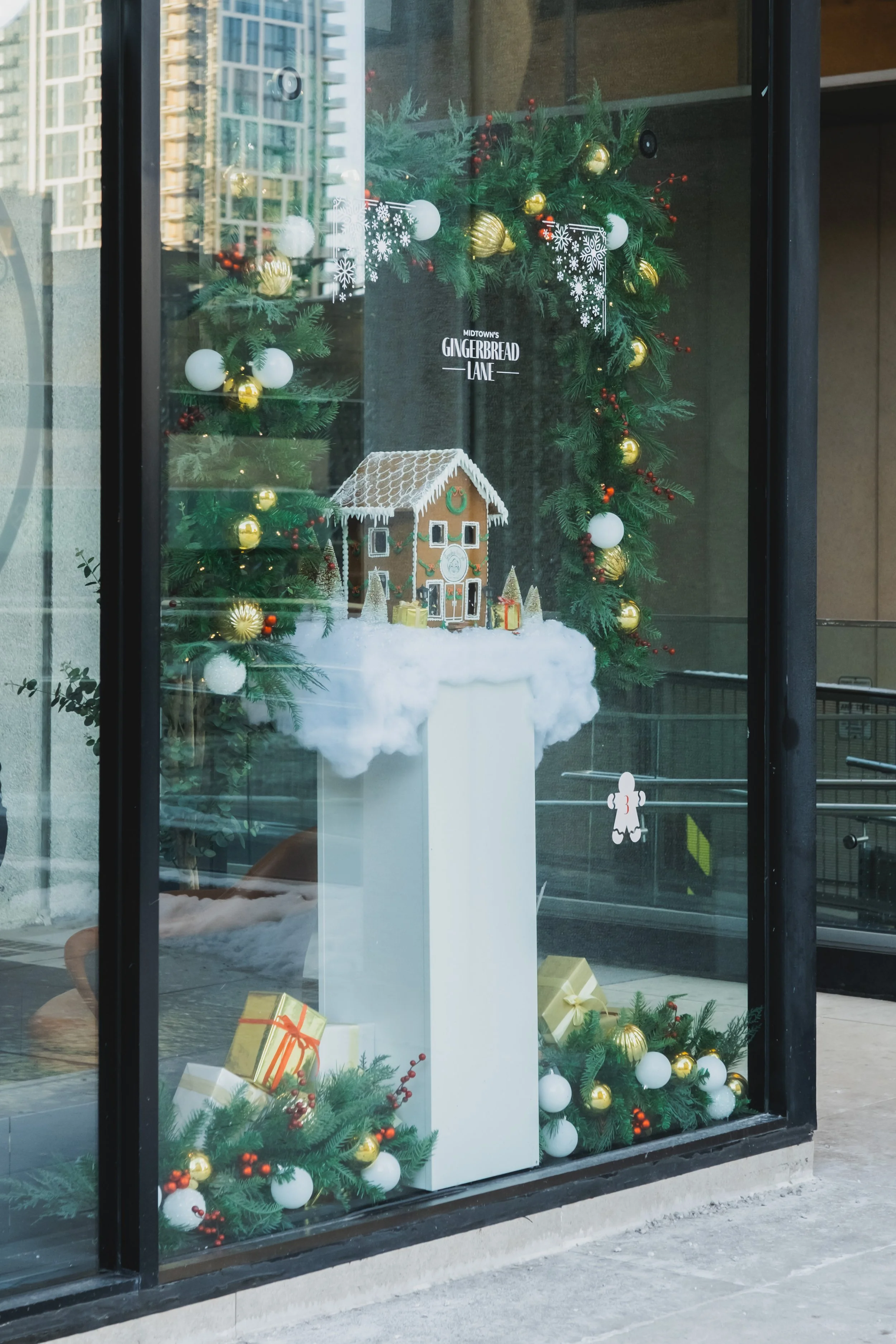Street-facing holiday storefront window display created for Midtown’s Gingerbread Lane, designed to activate pedestrian engagement in Toronto.