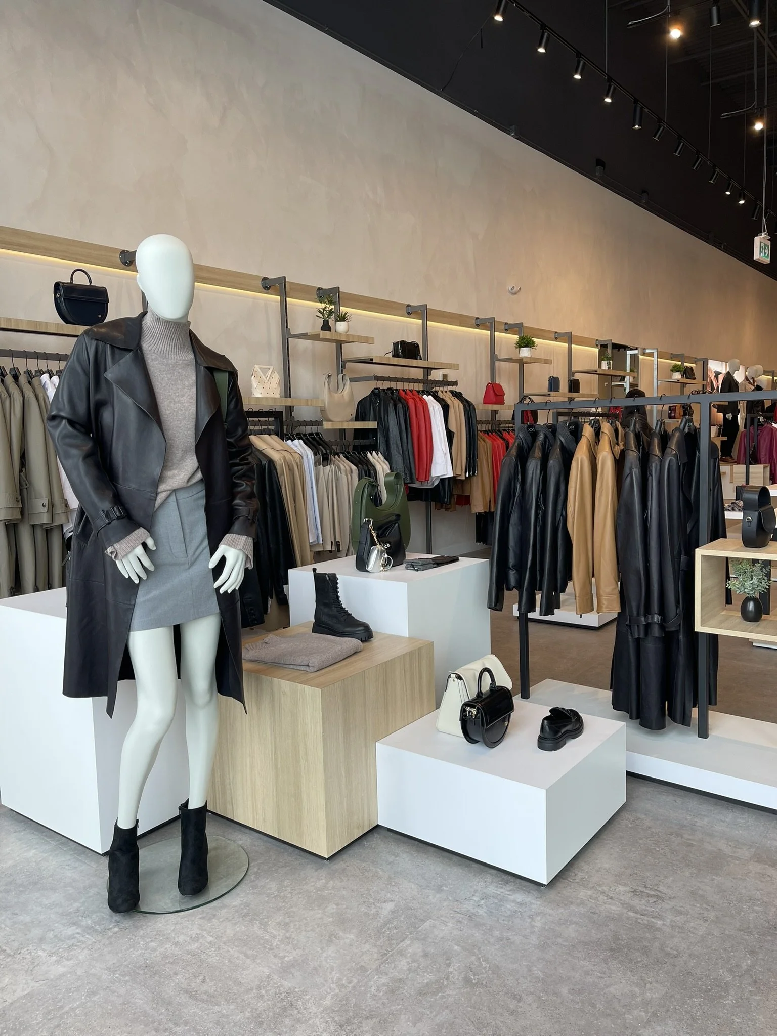 Danier storefront front display designed to attract foot traffic and communicate brand identity during retail store opening