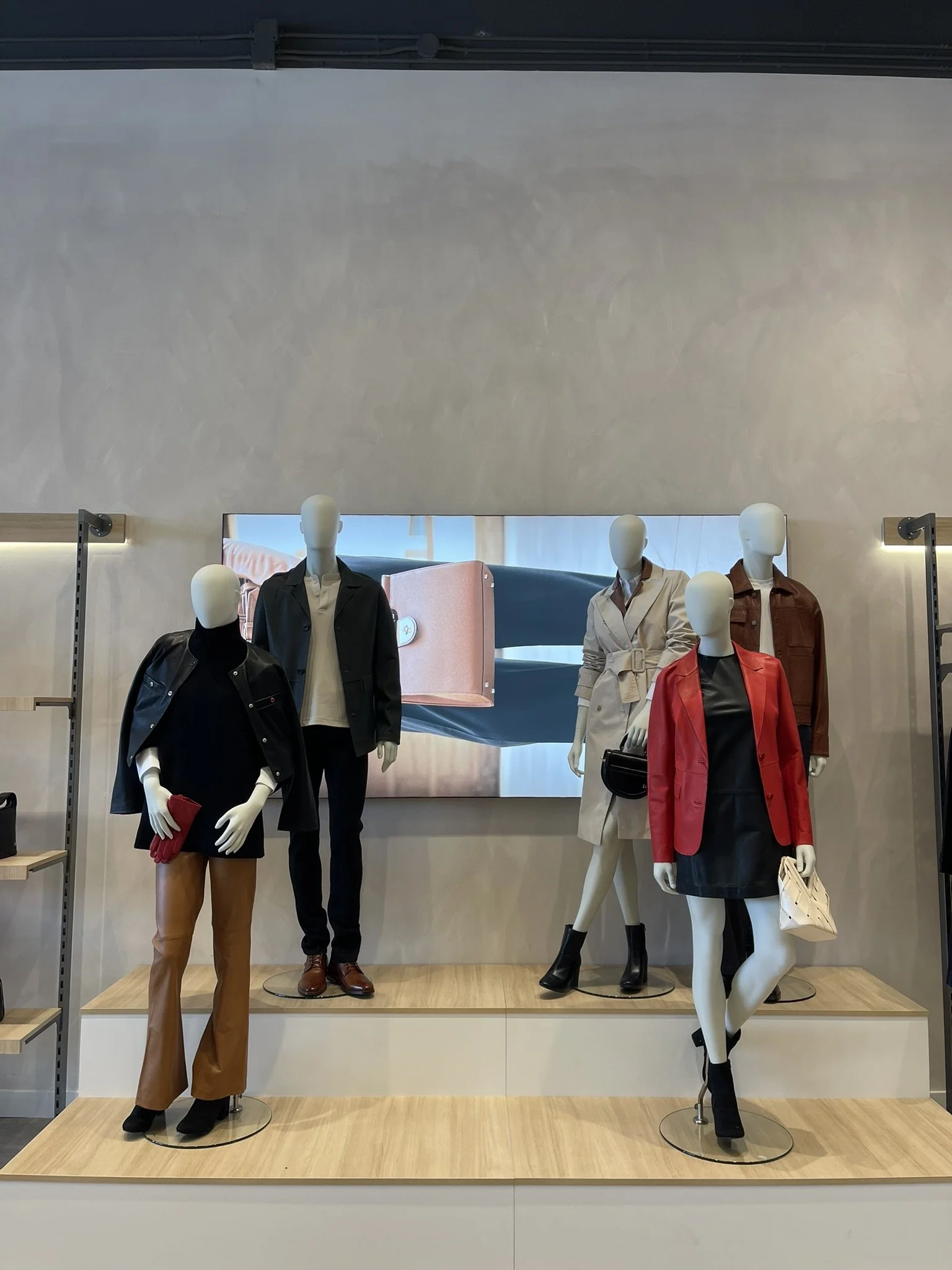 Leather jacket display at Danier store using structured visual merchandising to improve product visibility and shopability