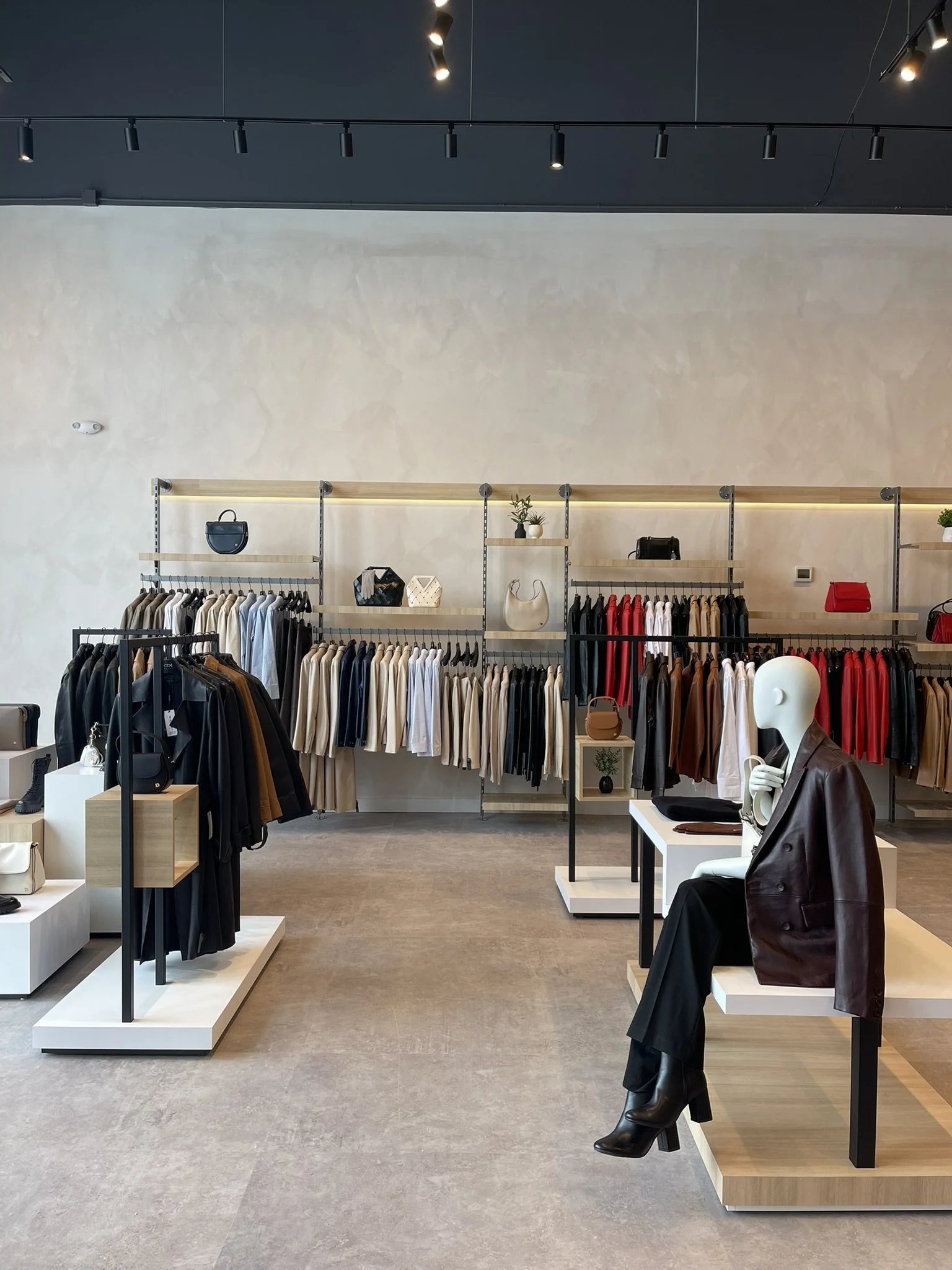 Retail display detail at Danier showing signage, styling, and fixture coordination for a cohesive in-store presentation