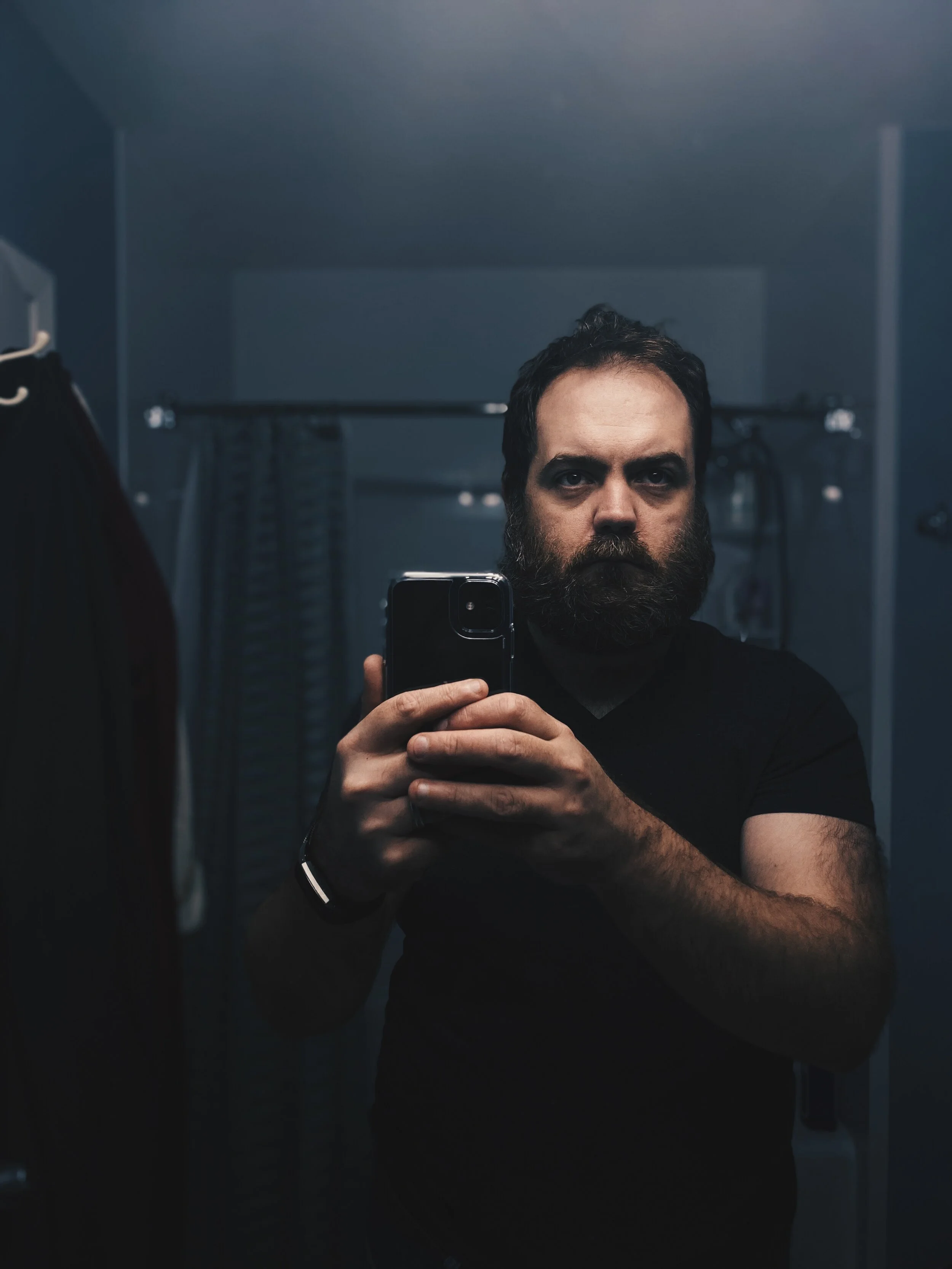 Mirror selfie with moody lighting