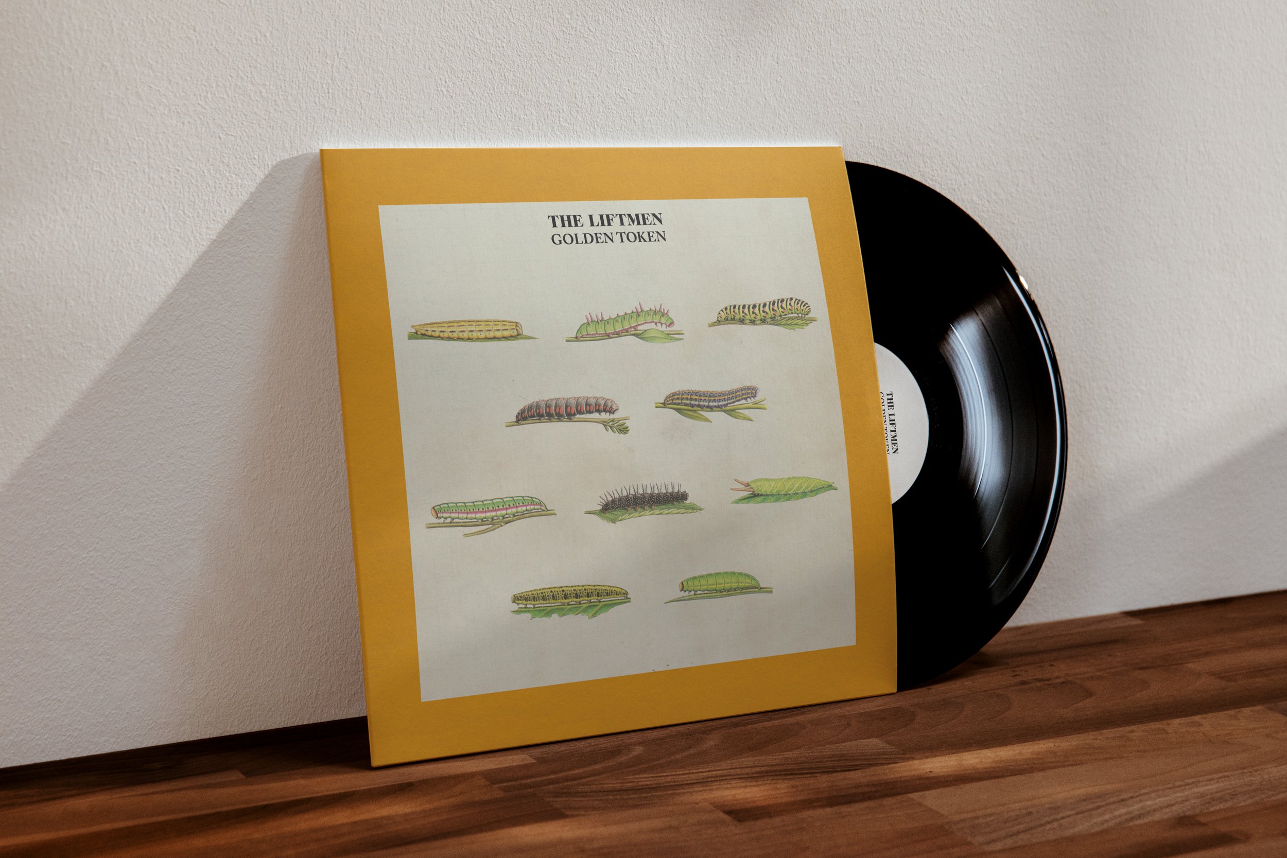The Liftmen Golden Token mockup 3.jpg