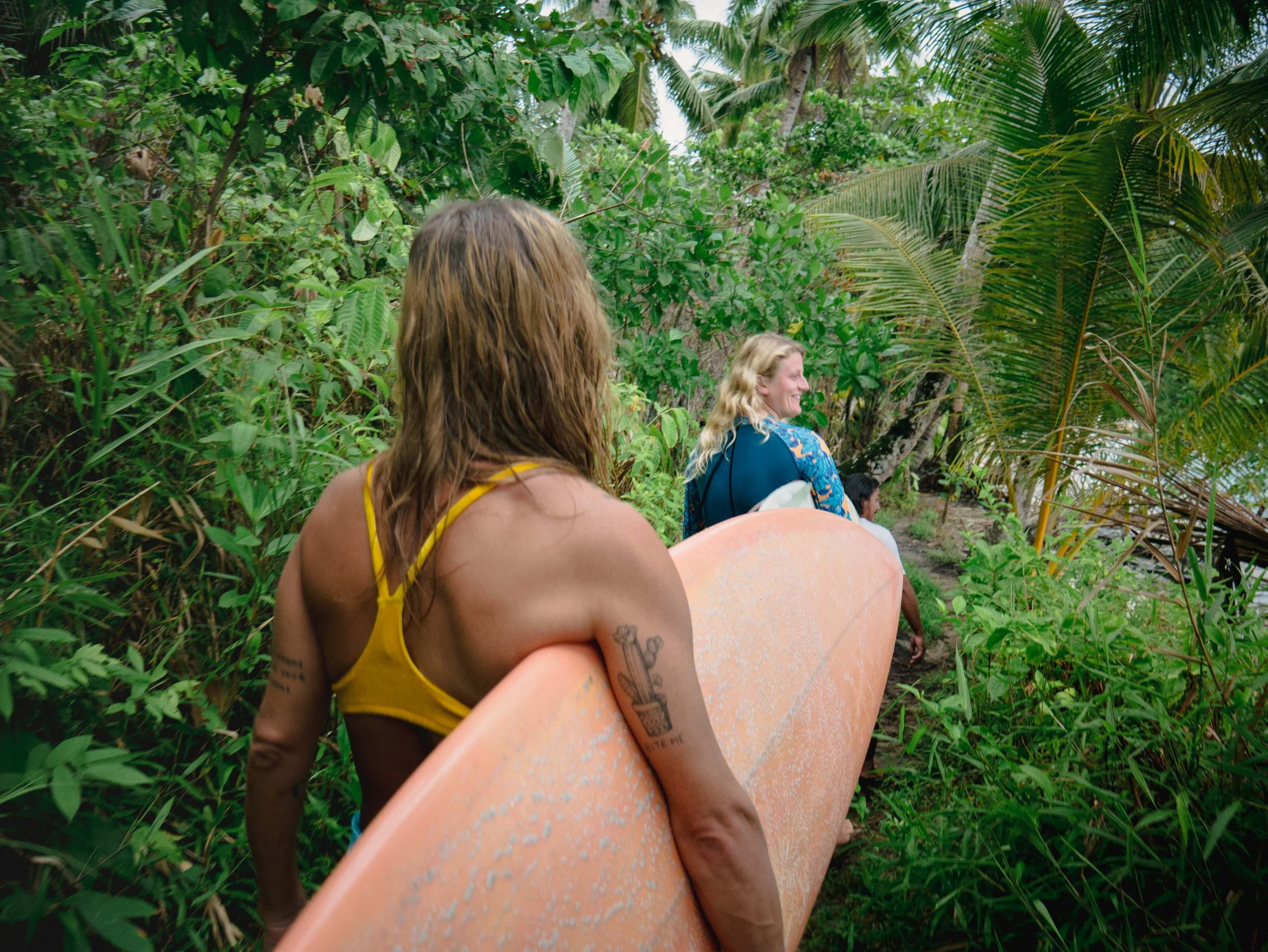 surfers in mentawai jungle