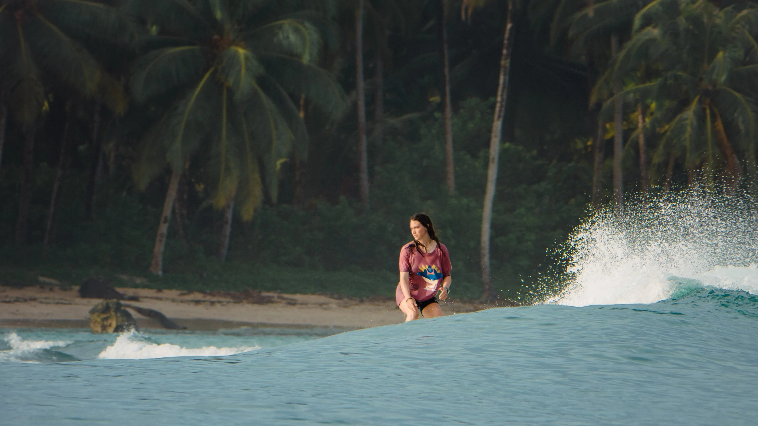 a woman riding wave