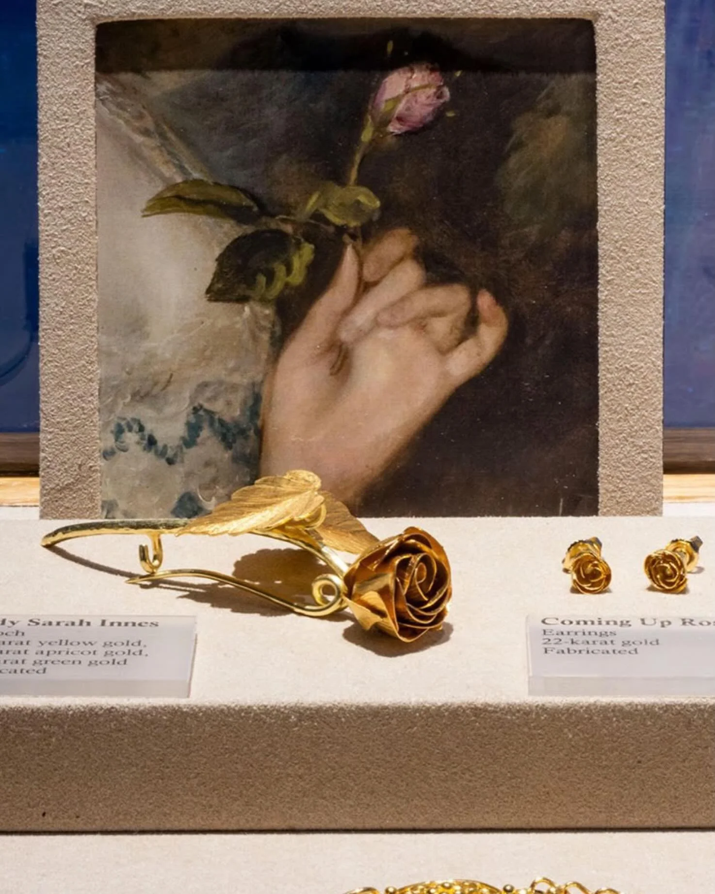 &ldquo;Lady Sarah Innes&rdquo; Rose Brooch in 22-karat gold alongside &ldquo;Coming Up Roses&rdquo;, on display in the @frickcollection Museum Shop. Photo by @kmarksphoto for @nytimes
